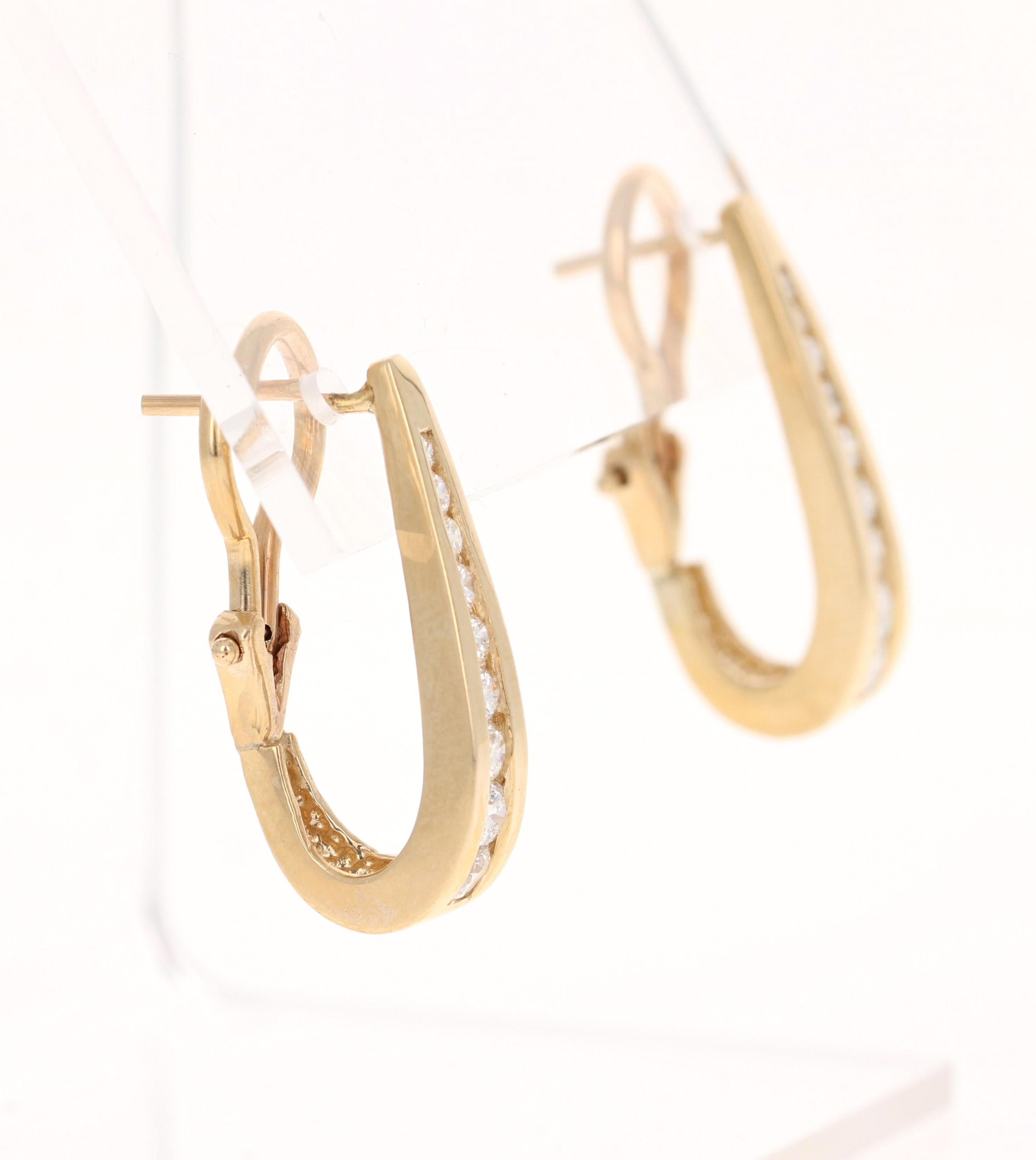 These beautiful hoop channel set earrings have 18 Round Cut Diamonds 0.85 Carats. (Clarity: VS, Color: H)

The hoops are set in 14 Karat Yellow Gold and weigh approximately 6.6 grams. They are approximately 0.75 inches long. 


