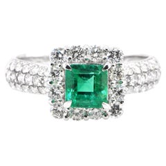 0.85 Carat Natural Emerald and Diamond Halo Engagement Ring Set in Platinum