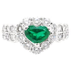 0.85 Carat Natural Heart Cut Emerald and Diamond Halo Ring Set in Platinum