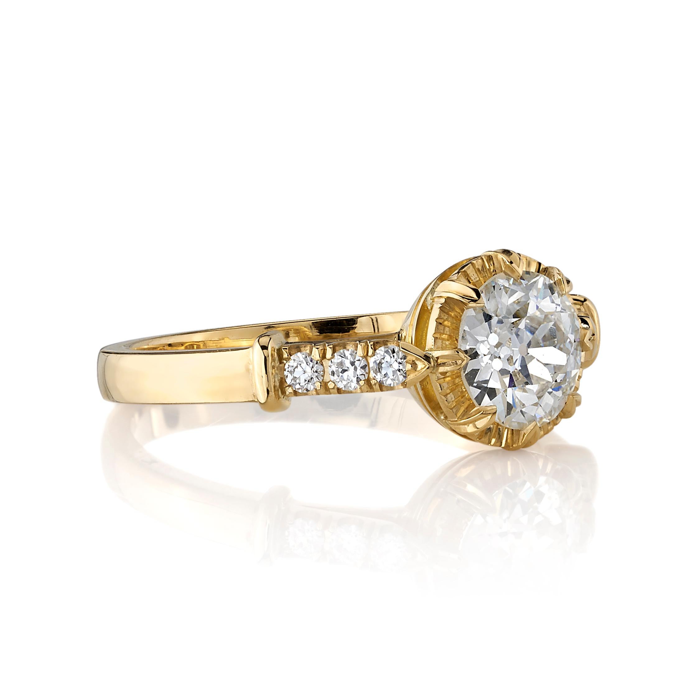 0.85ct J/SI2 GIA certified old European cut diamond with 0.11ctw old European cut accent diamonds set in a handcrafted 18K yellow gold mounting.

Ring is currently a size 6 and can be sized to fit.