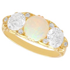 0.85 Carat Opal 1.68 Carat Diamond, 18k Yellow Gold Trilogy Ring Circa 1890
