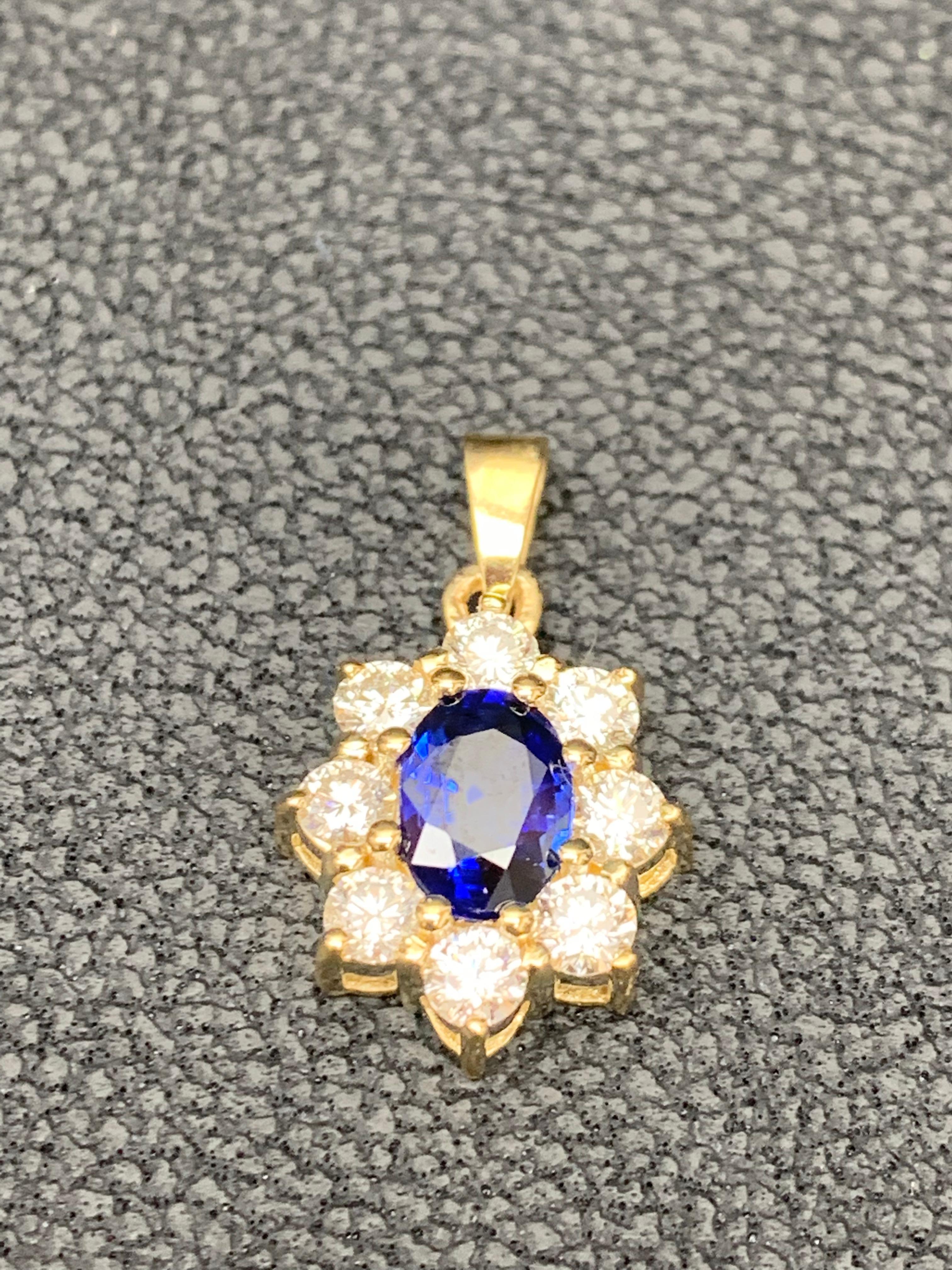 0.85 Carat Oval Cut Blue Sapphire and Diamond Halo Flower Pendant Necklace In New Condition For Sale In NEW YORK, NY