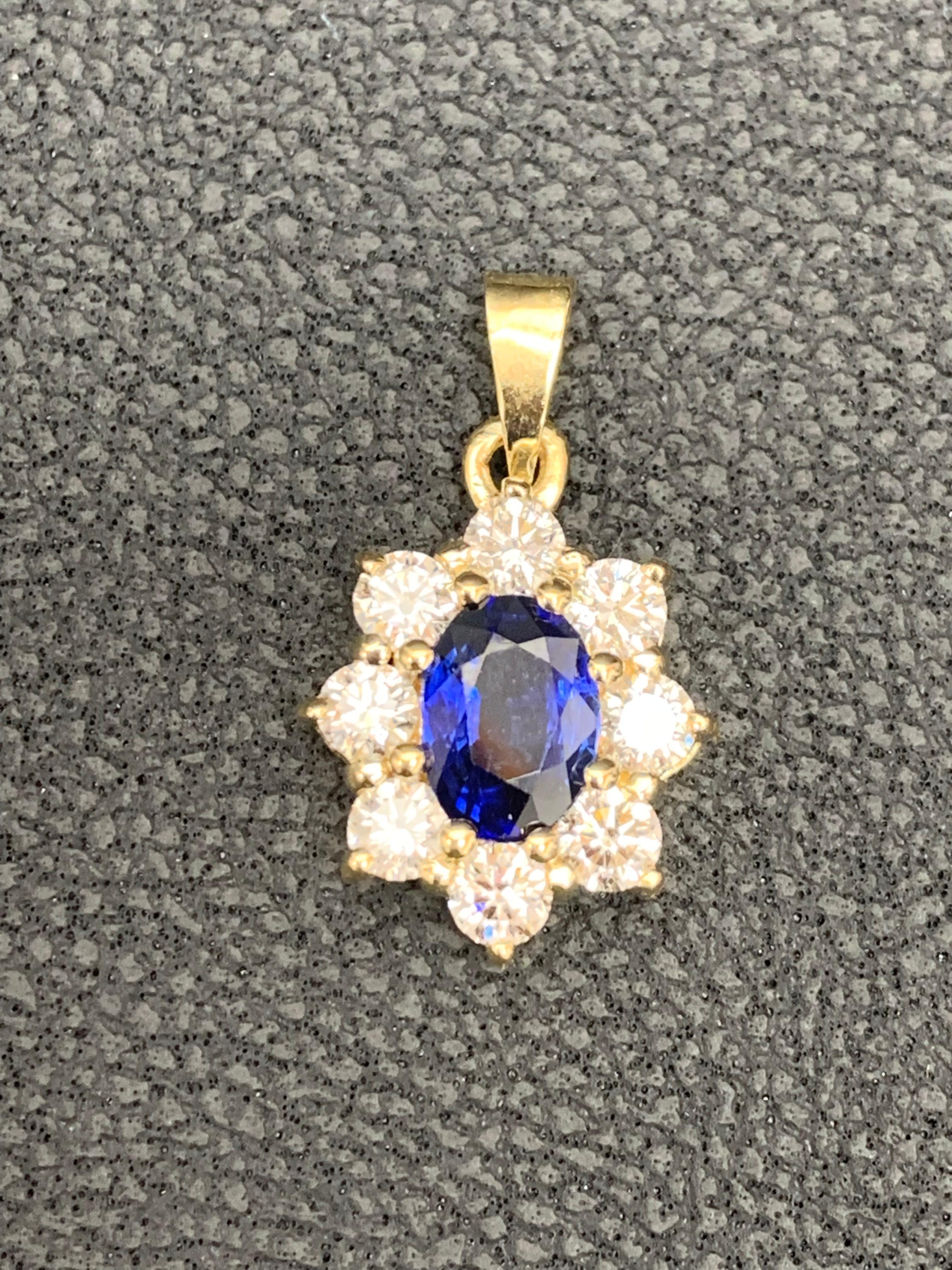 Women's 0.85 Carat Oval Cut Blue Sapphire and Diamond Halo Flower Pendant Necklace For Sale