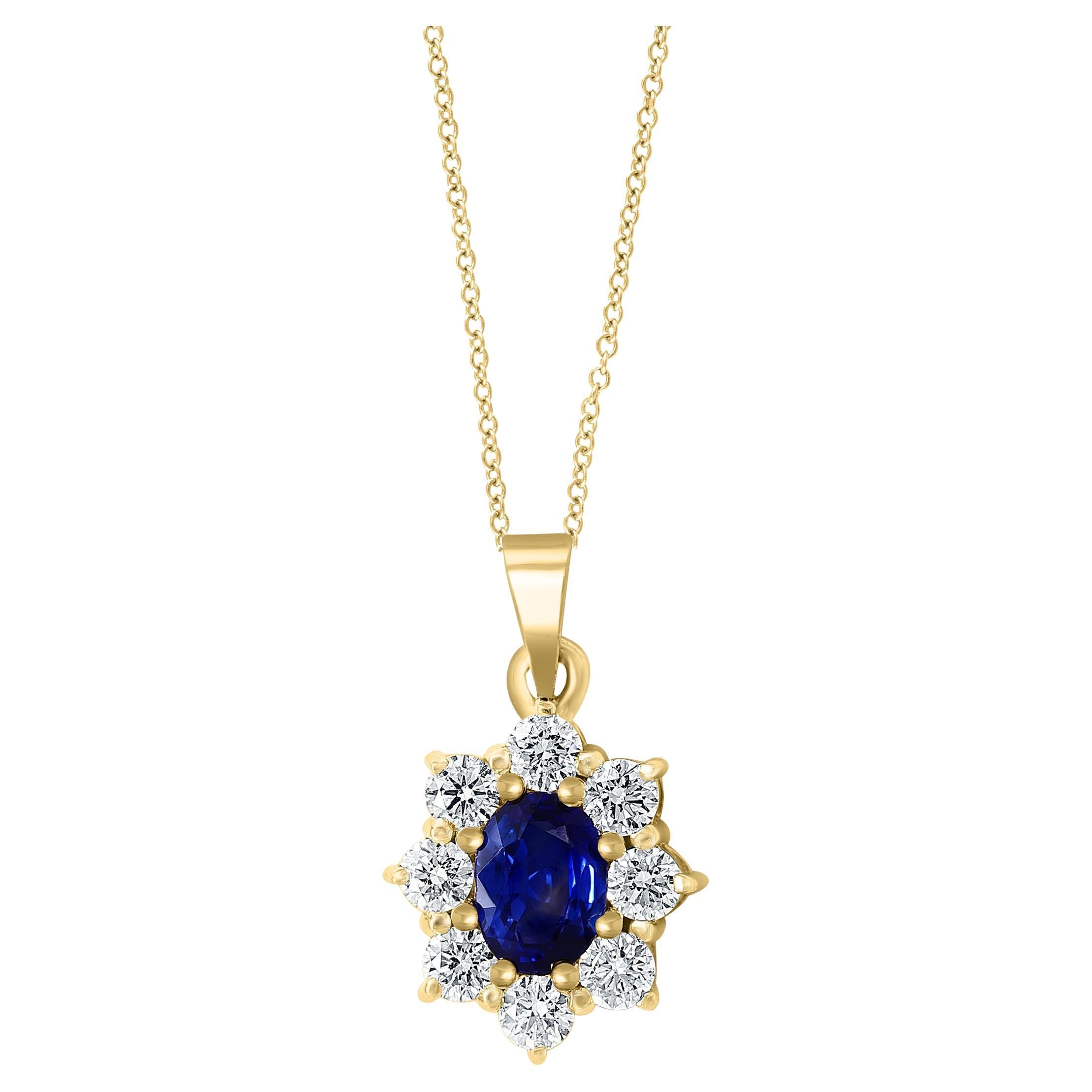 0.85 Carat Oval Cut Blue Sapphire and Diamond Halo Flower Pendant Necklace For Sale