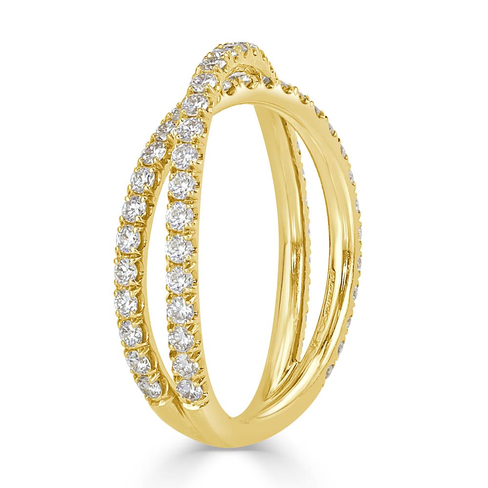 Created in 18k yellow gold, this exquisite crisscross diamond wedding band showcases 0.85ct of perfectly matched round brilliant cut diamonds set in a micro pavé setting style. The diamonds are graded at E-F in color, VS1-VS2 in clarity.
