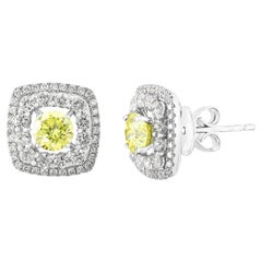0.85 Carat Round Cut  Fancy Yellow Diamond Stud Earrings in 18K White Gold