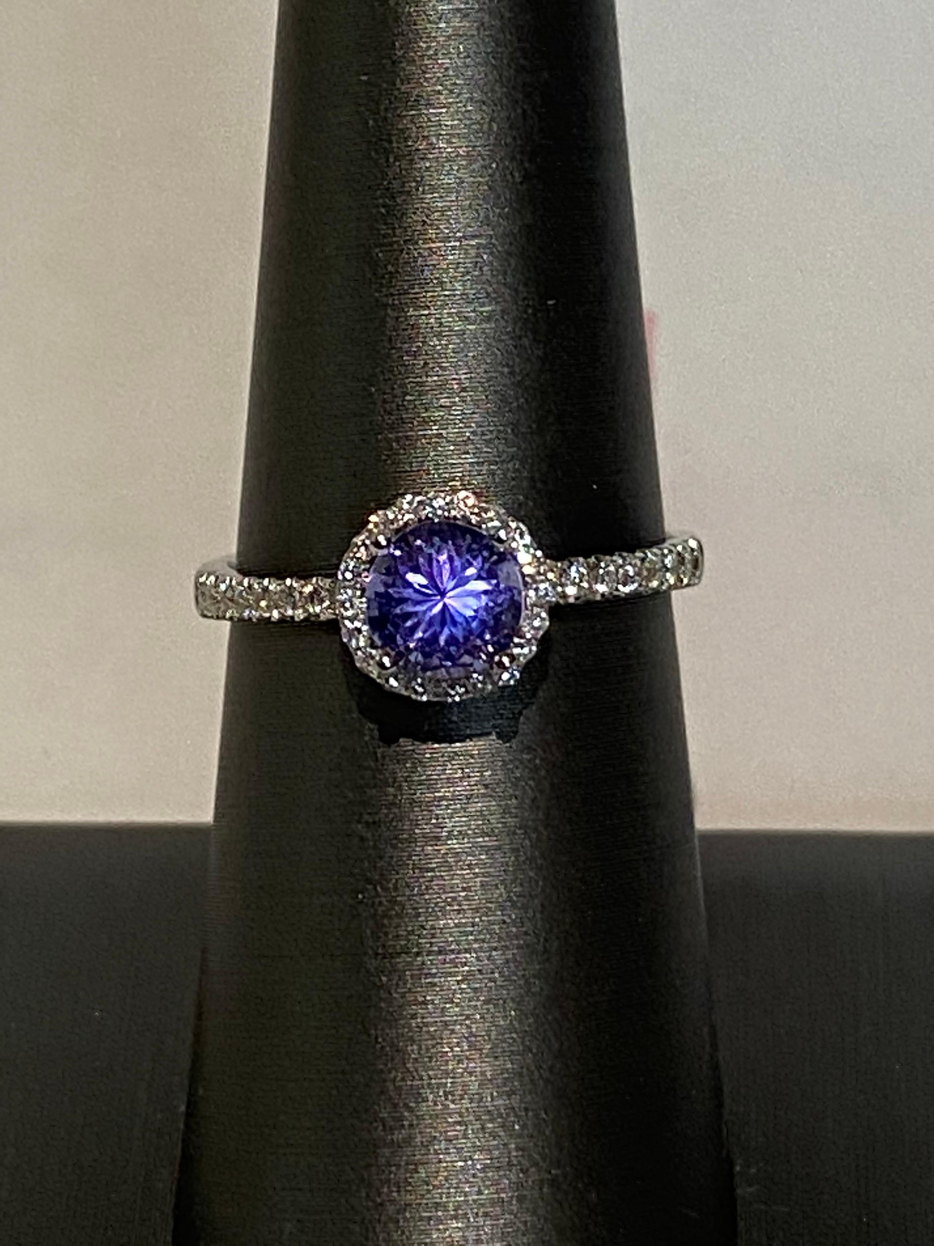 Halo and pave settings of white diamonds on a thin band enhances the round tanzanite and makes it a very simple and chic ring. Crafted with hand in white gold.
Tanzanite: 0.85ct
White Diamond: 0.20ct
White Gold: 14K
Size: 7 (resizeable)