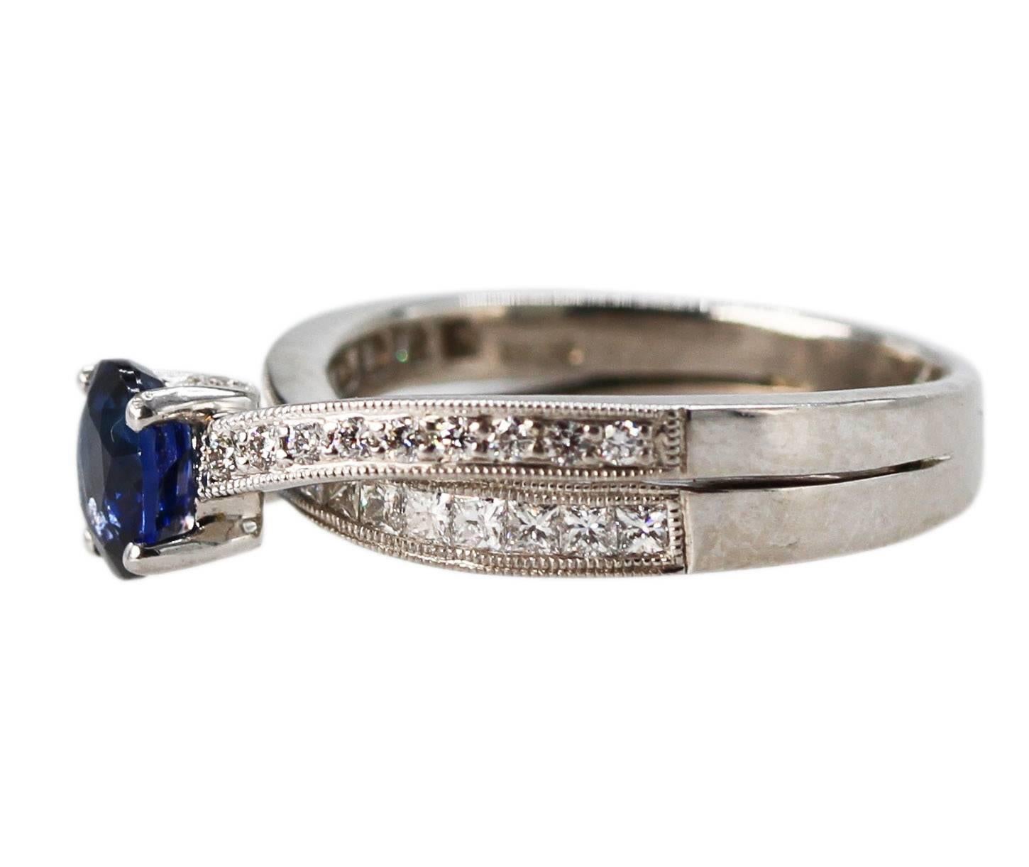 Platinum, Sapphire and Diamond Ring
• Stamped PT950
• Oval sapphire approximately 0.85 carat
• 22 round diamonds weighing approximately 0.15 carat
• 17 princess-cut diamonds approximately 0.60 carat
• Size 6 1/2, gross weight of 8.4 grams, measuring