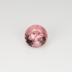 0.85 ct, Faceted pinkish peach round tourmaline