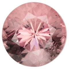0.85 ct, Faceted pinkish peach round tourmaline