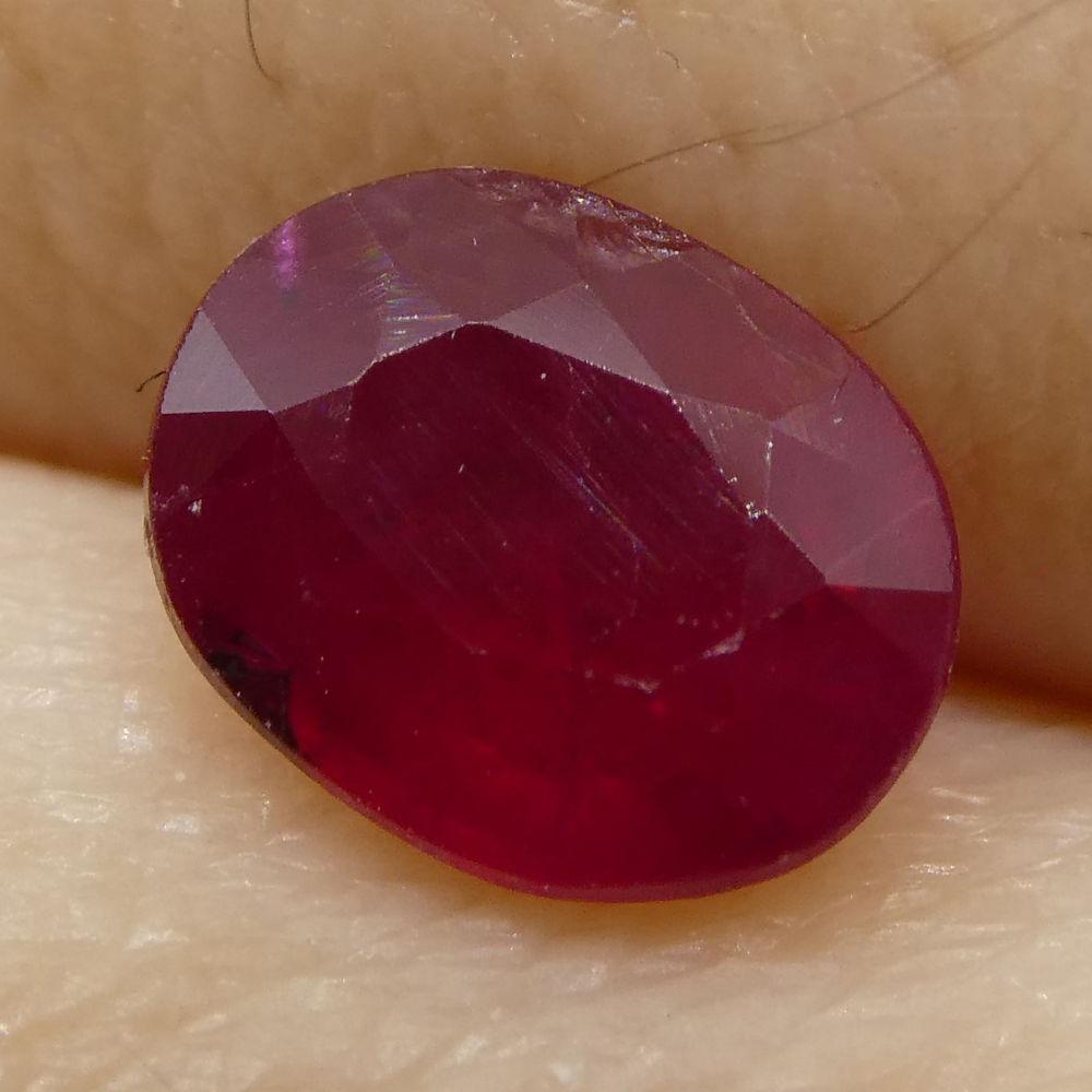Description:

Gem Type: Ruby
Number of Stones: 1
Weight: 0.85 cts
Measurements: 6.04x4.69x3.05 mm
Shape: Oval
Cutting Style Crown: Modified Brilliant
Cutting Style Pavilion: Step Cut
Transparency: Translucent
Clarity: Moderately Included: Inclusions