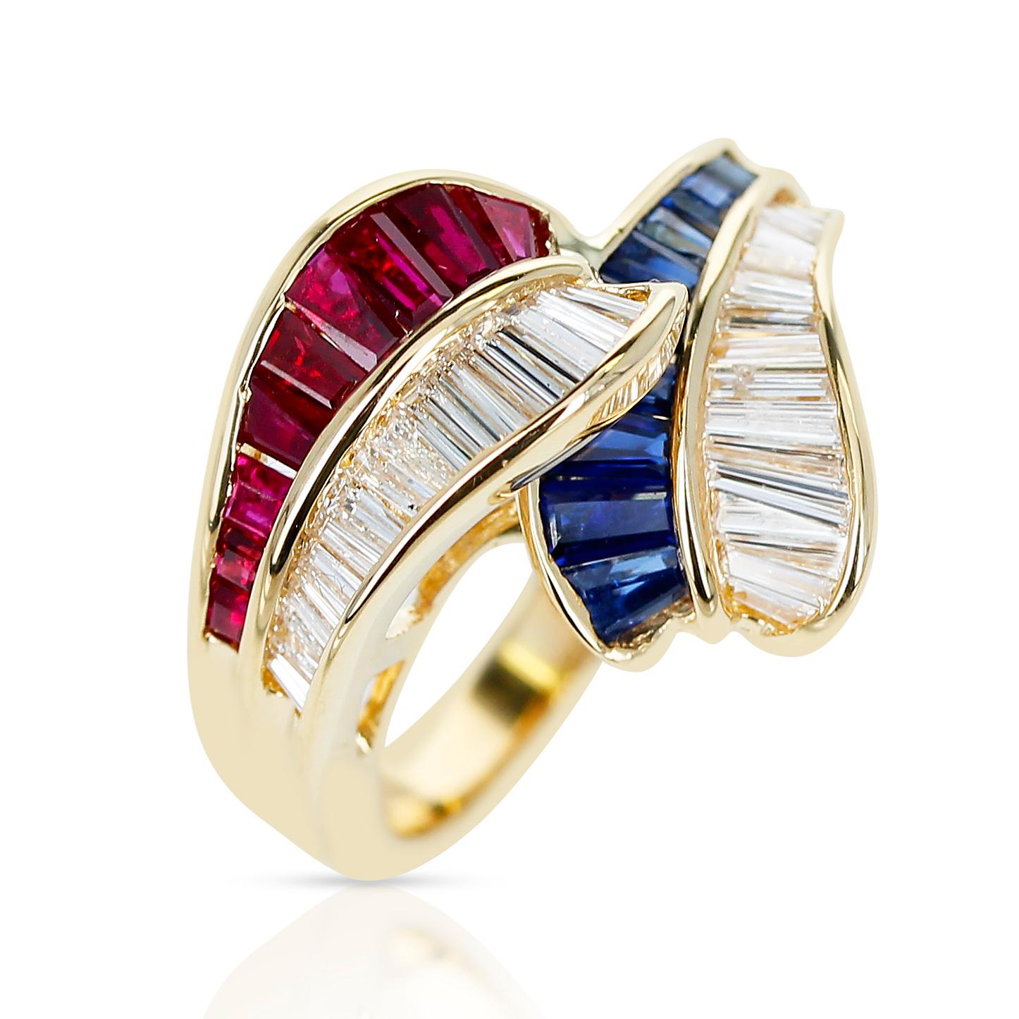 An overlapping ring with 0.85 ct. Ruby, 0.85 ct. Sapphires and 0.84 ct. Diamonds made in 18 Karat Yellow Gold. The total weight of the ring is 6.69 grams. Ring Size US 6.25.