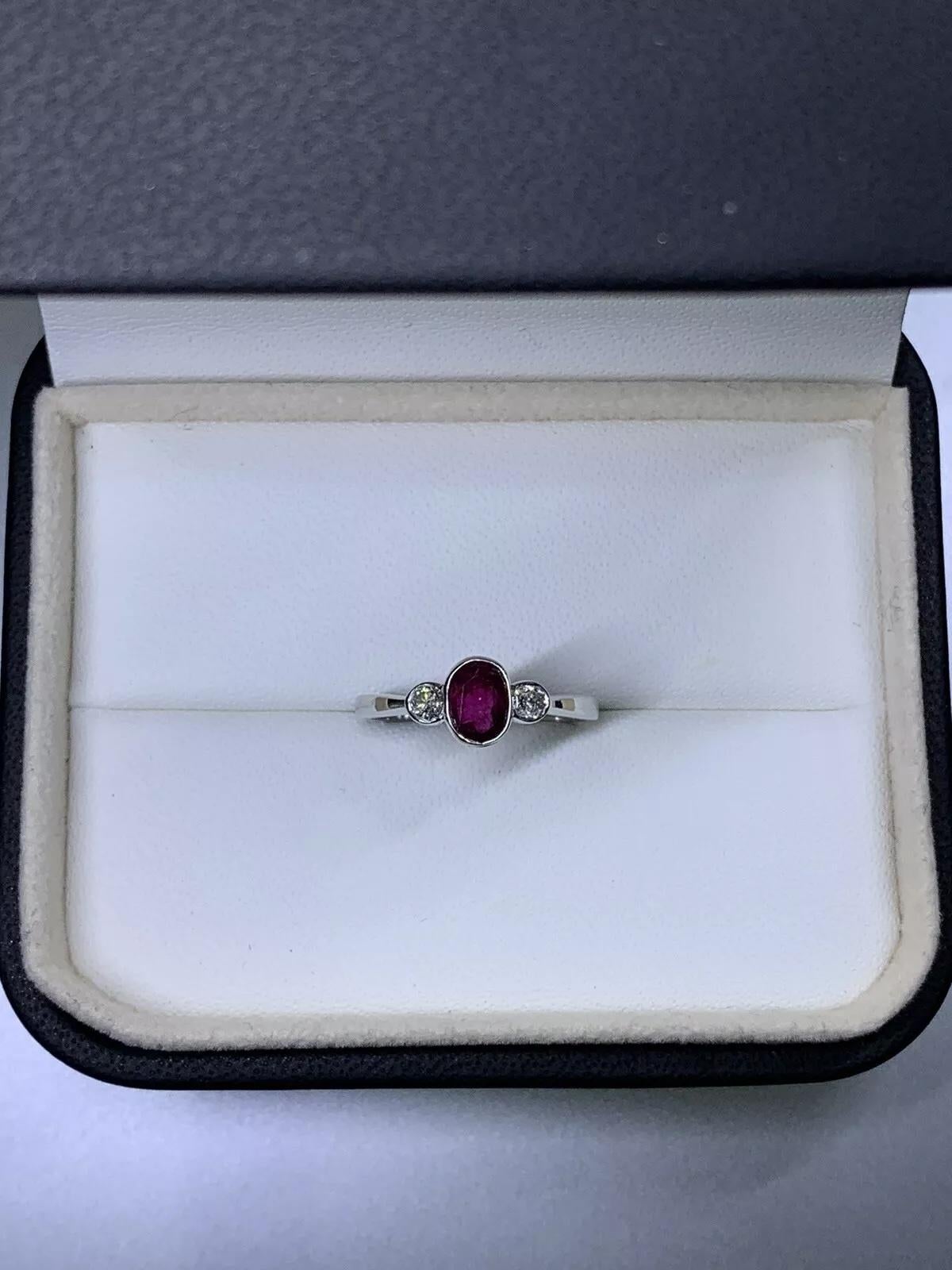 0.85 Ruby diamond engagement ring in 9ct white gold.