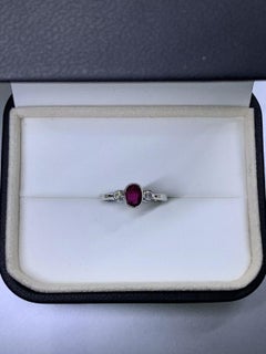 0.85 Ruby diamond engagement ring in 9ct white gold.