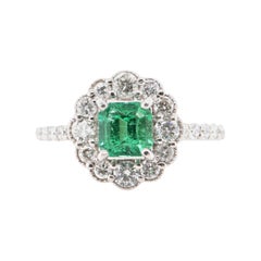 0.854 Carat Colombian Emerald and Diamond Cluster Ring Set in Platinum