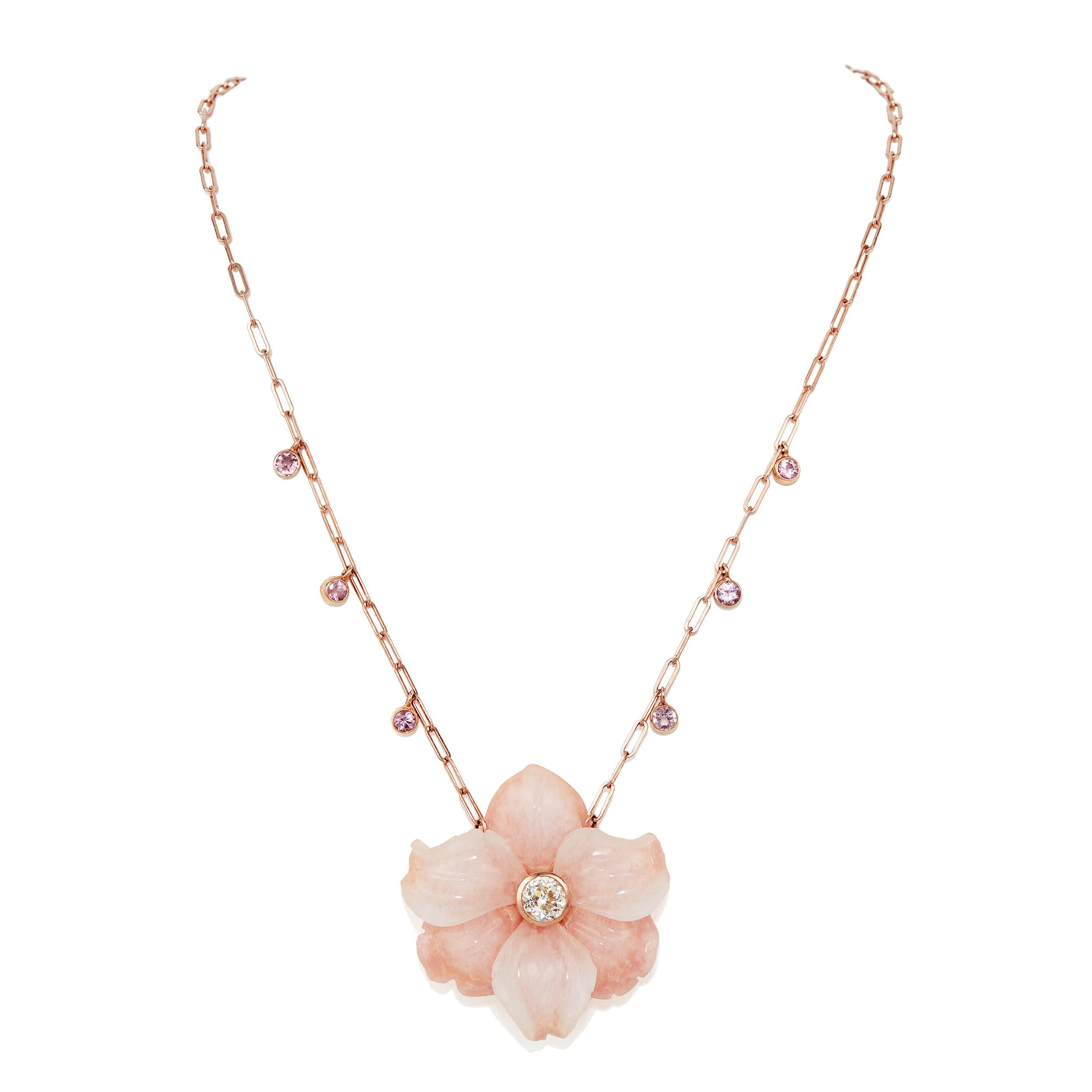An incredible one-of-a-kind necklace that is sure to bring light and fun into any occasion! 

Round Brilliant Diamond Center Weighing 0.855 Carats

Icy Quartzite & Pink Calcite Carved Flower - 35 mm

Pink Round Faceted Spinel - 3 mm 

Carved Flower