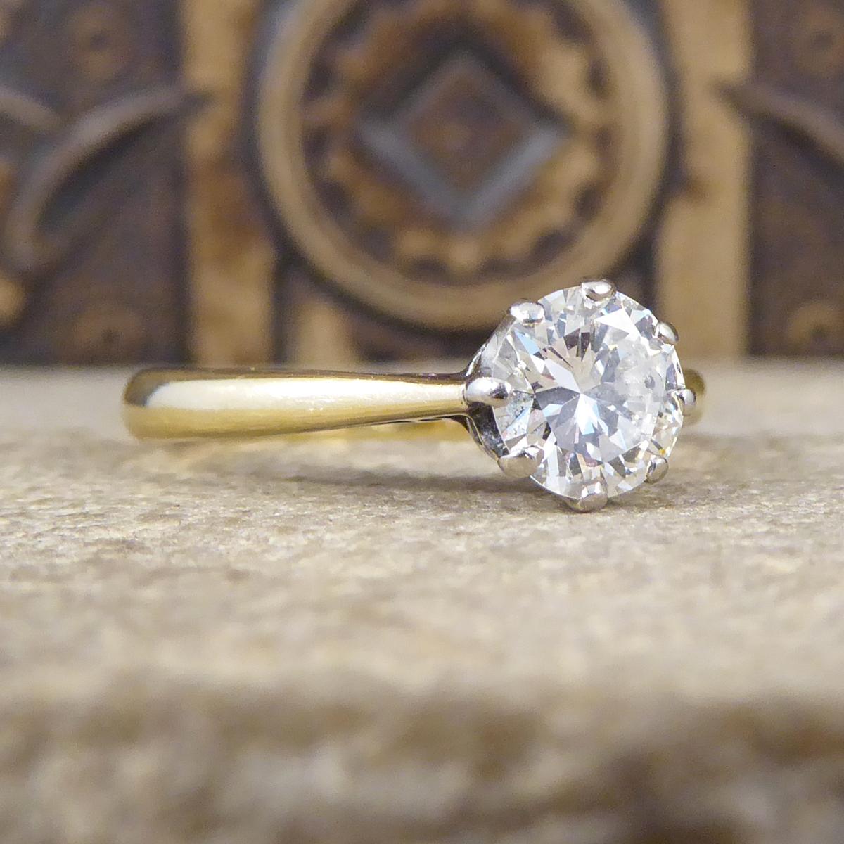 This beautifully sparkly engagement ring holds a Brilliant cut Diamond weighing 0.85ct and is set in a Platinum eight claw setting leading down to an 18ct band with 