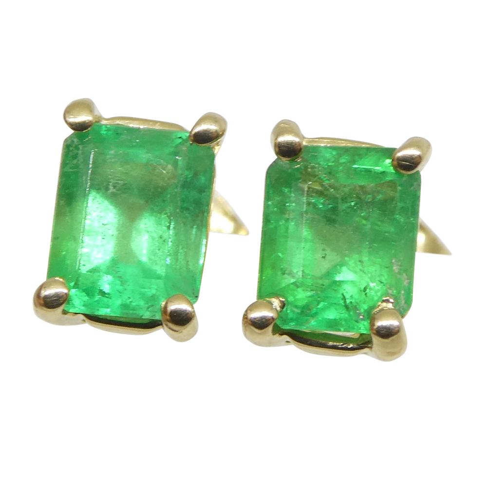 Women's or Men's 0.85ct Emerald Cut Green Colombian Emerald Stud Earrings set in 14k Yellow Gold For Sale