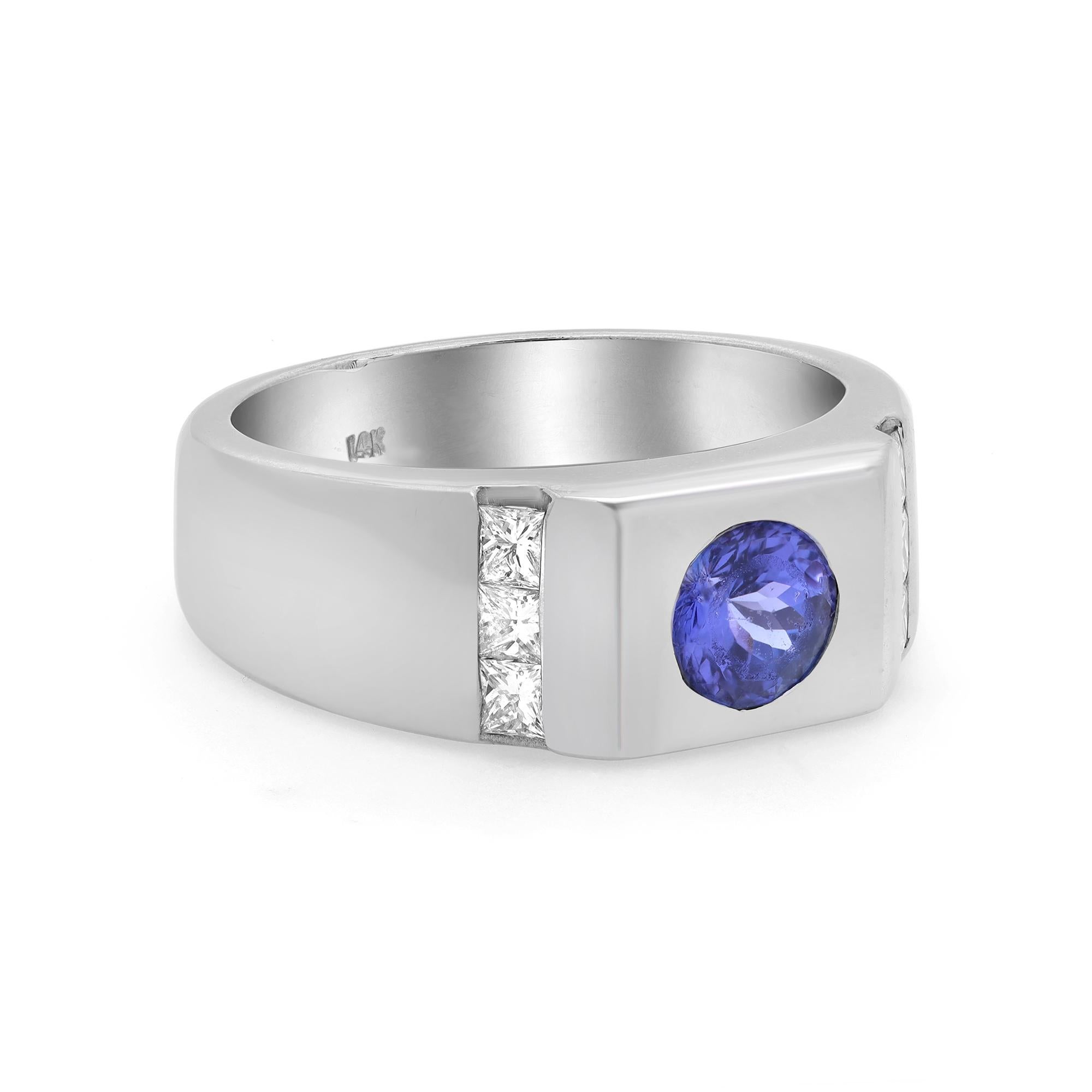 This stunning men's ring is crafted in 14K white gold and features a center stone: round cut Tanzanite weighing 0.85 carat with accents stones: 6 princess cut white diamonds weighing 0.50 carat. Ring size: 10.5. Band width: 9.33 mm. Total weight: