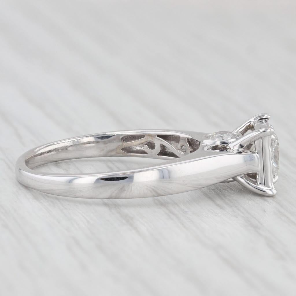 Gemstone Information:
- Natural Diamond (center) -
Carats - 0.50ct 
Cut - Princess
Color - H - I
Clarity - I1 
Please note this diamond is filled.

- Natural Diamonds (accents) -
Total Carats - 0.35ctw
Cut - Round Brilliant
Color - H -I
Clarity - I1