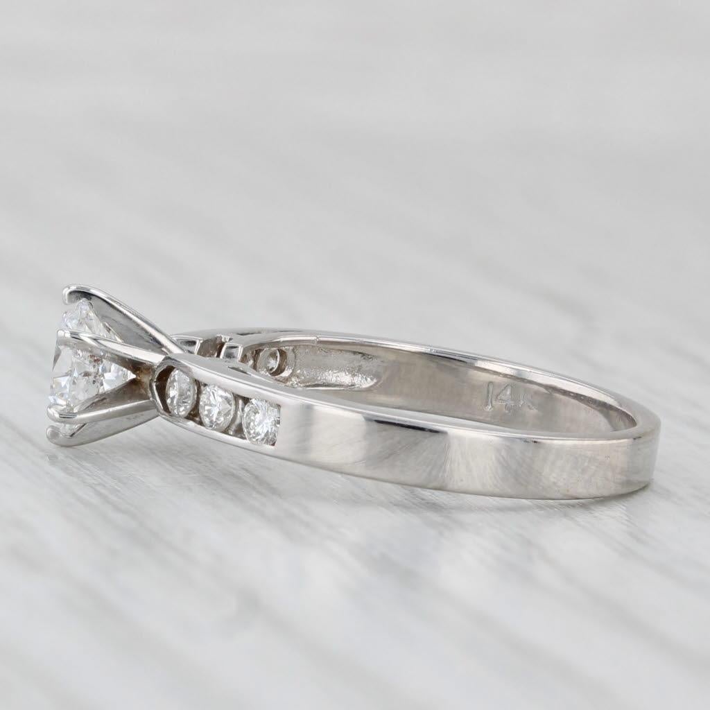 Gemstone Information:
- Natural Diamond -
Carats - 0.85ctw (0.65ct center, 0.20ctw accents)
Cut - Round Brilliant
Color - G - H
Clarity - SI1 - I1

Metal: 14k White Gold
Weight: 2.7 Grams 
Stamps: 14k
Face Height: 6.7 mm 
Rise Above Finger: 7.6