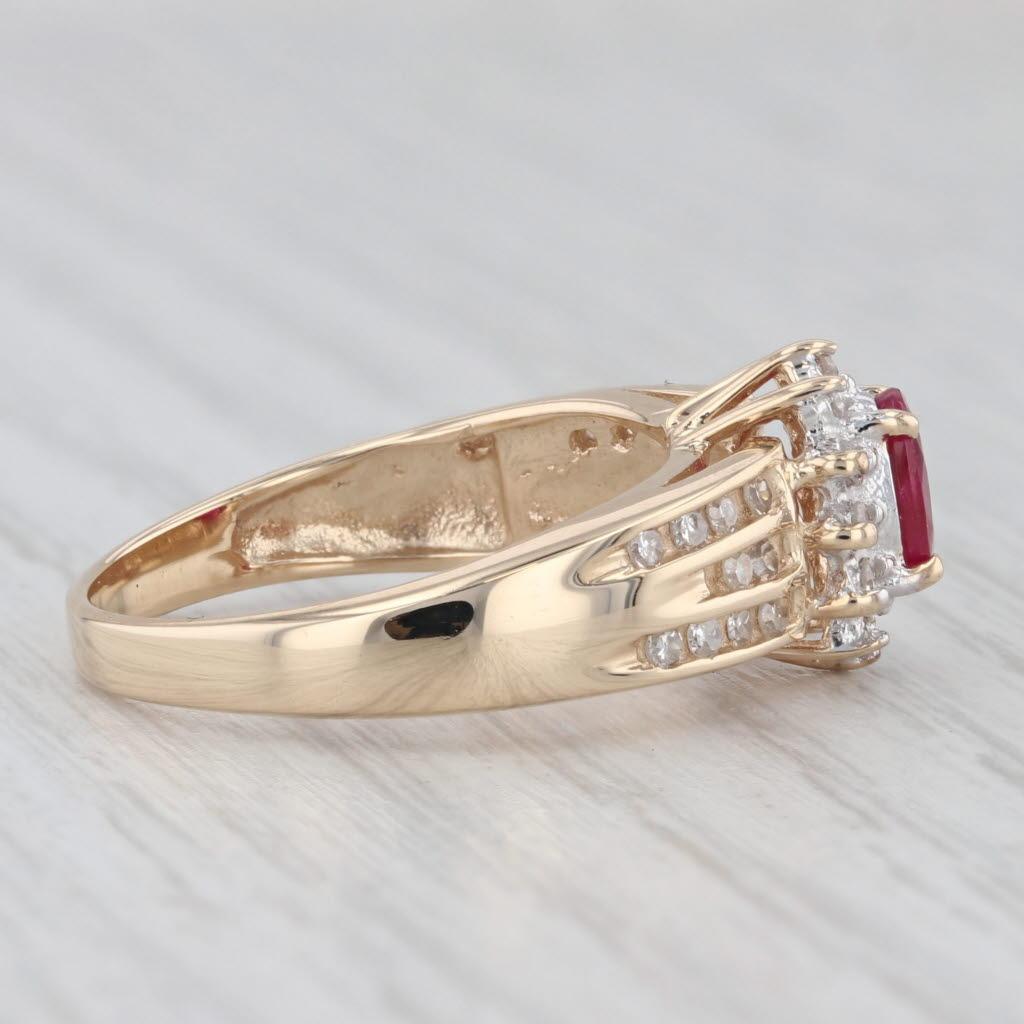 Gemstone Information:
- Natural Ruby -
Carats - 0.60ct 
Cut - Oval 
Color - Red
Treatment - Routinely Enhanced 

- Natural Diamonds -
Total Carats - 0.25ctw
Cut - Single
Color - I - J
Clarity - SI2 - I1

Metal: 14k Yellow Gold
Weight: 4.3 Grams