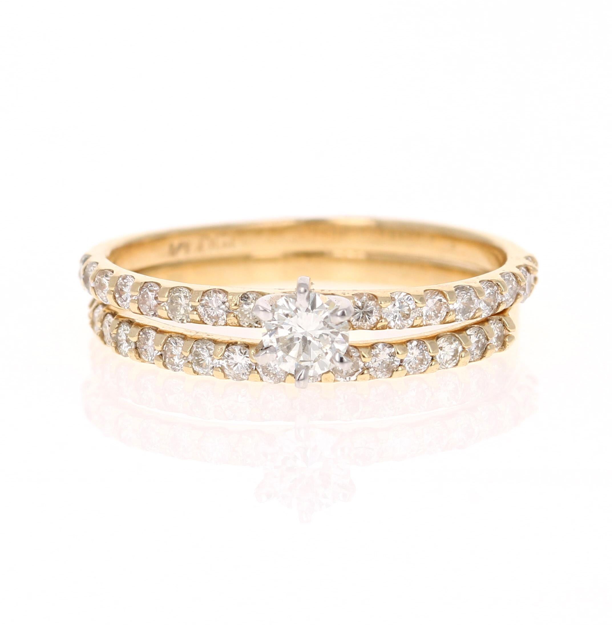 Beautiful Wedding Set in 14 Karat Yellow Gold

The center round cut diamond weighs 0.22 Carats (Clarity: SI3-, Color: H) and is surrounded by 34 round cut diamonds on the shank and on the band that weigh 0.64 Carats (Clarity: SI2, Color: H) The