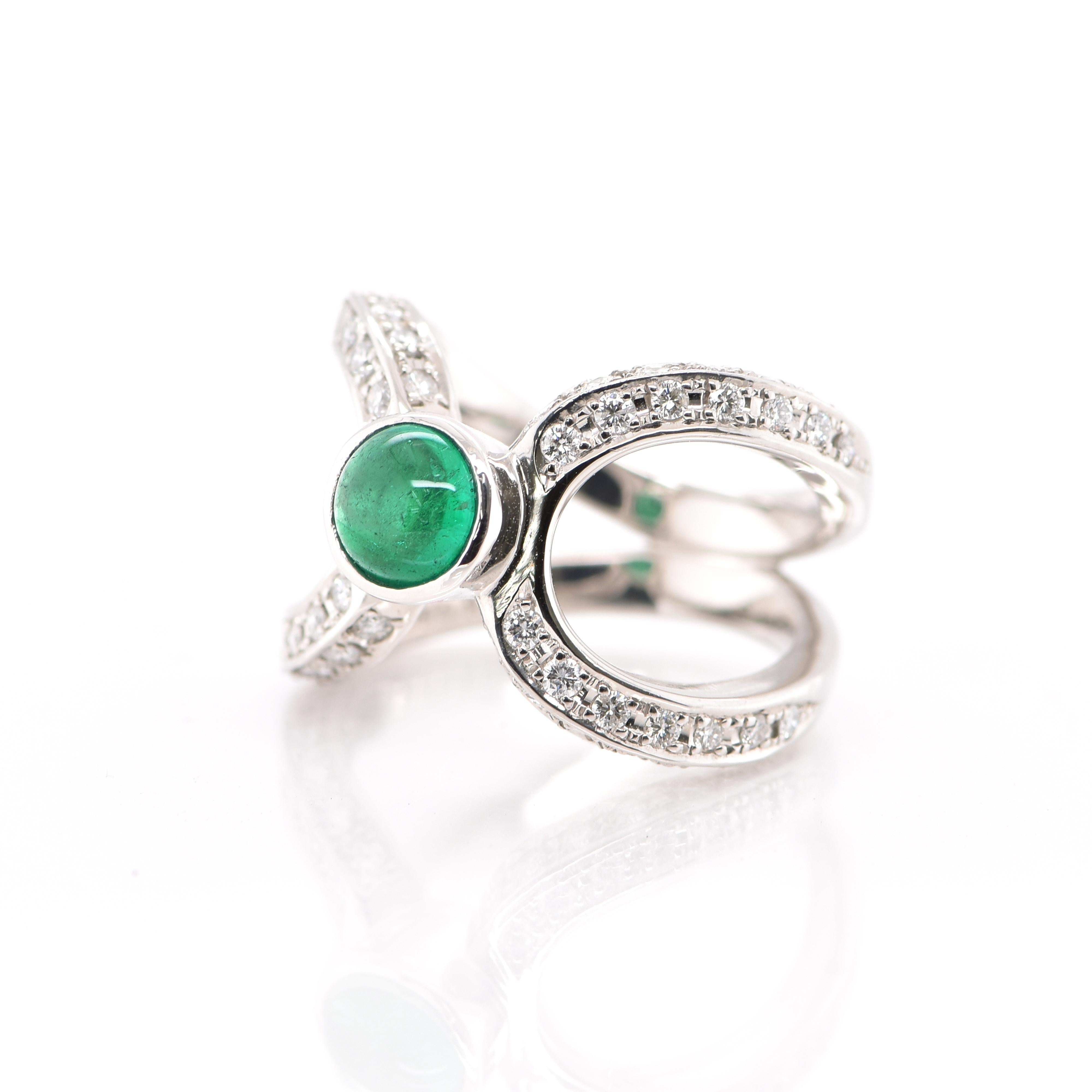A stunning Ring featuring a 0.86 Emerald Cabochon and 0.68 Carats of Diamond Accents set in Platinum. People have admired emerald’s green for thousands of years. Emeralds have always been associated with the lushest landscapes and the richest