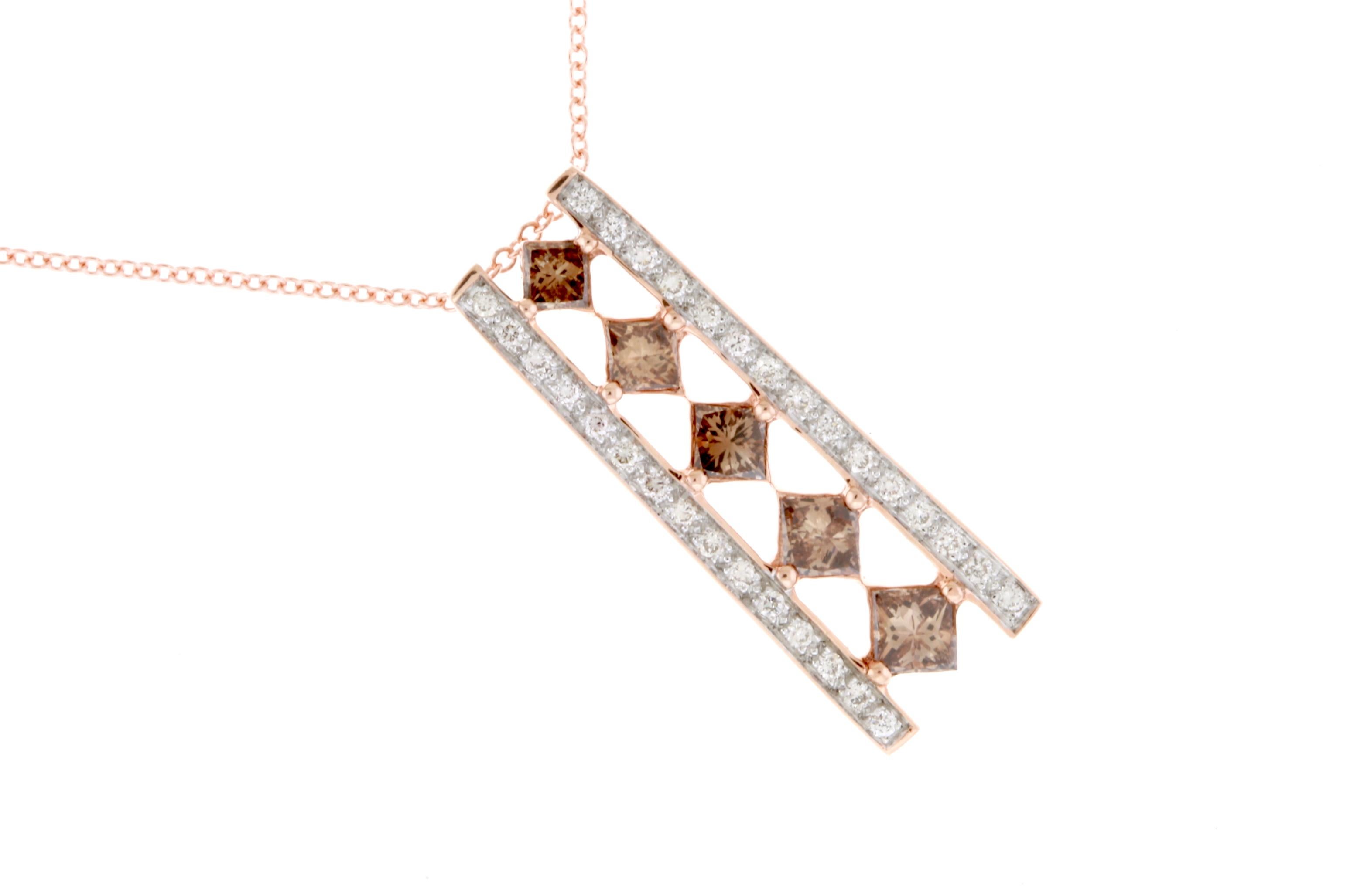 A truly elegant piece, this pendant features 5 Princess cut Natural Cognac Color Diamonds descending down the center. Diamonds align either side of the stones giving it that extra sparkle and wow factor!

Material: 14k Rose Gold 
Center Diamond