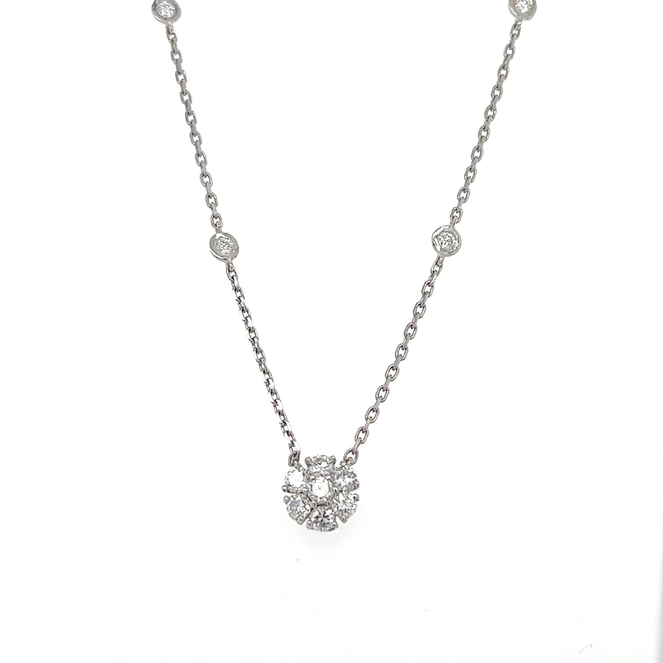 This floret diamond necklace has Natural Round Cut Diamonds that weigh 0.86 carats. The clarity and color of the necklace are VS-F.

The approximate weight of this necklace is 2.7 grams. 

The necklace is 16 inches long and the chain has diamonds