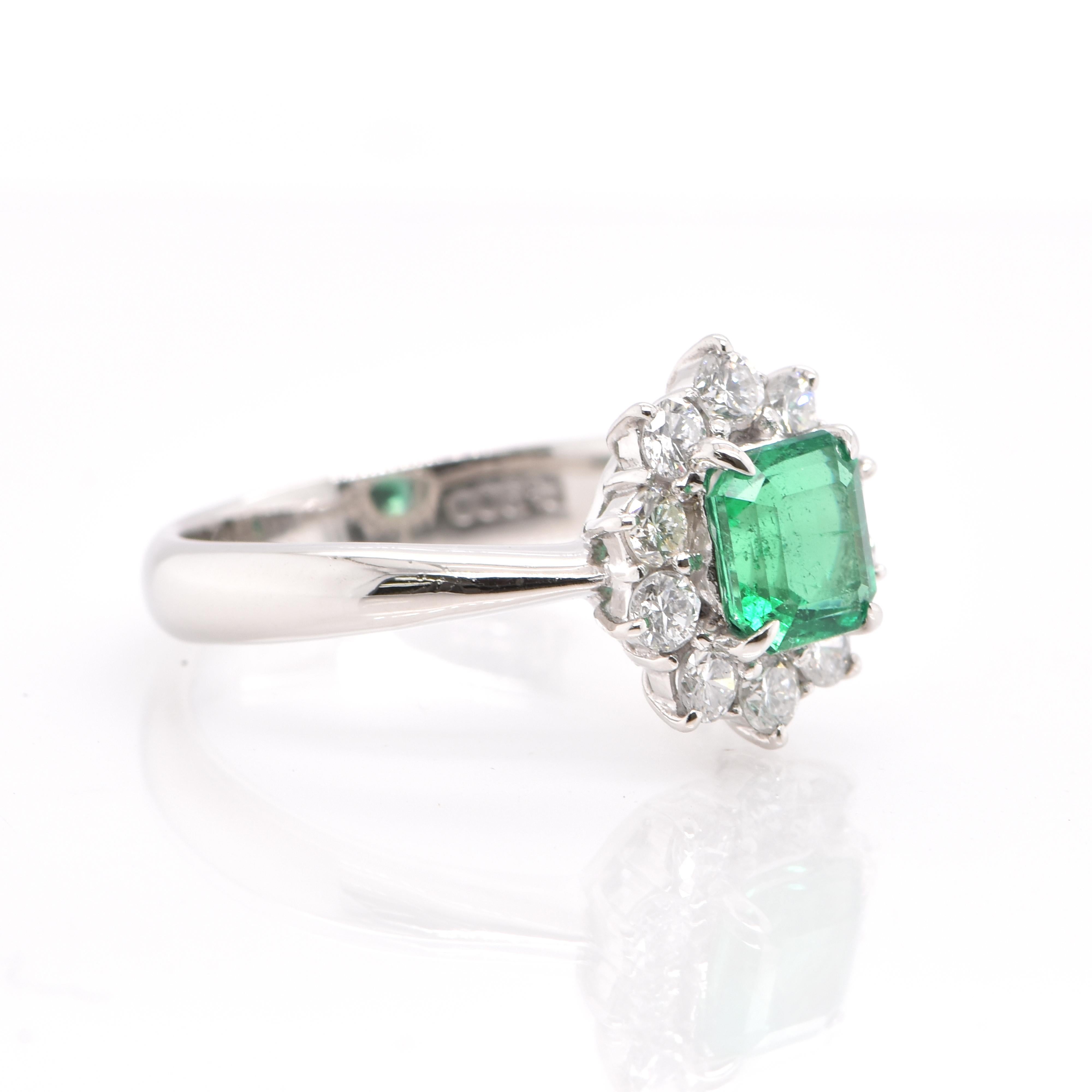 Modern 0.86 Carat Natural Emerald and Diamond Halo Ring Set in Platinum