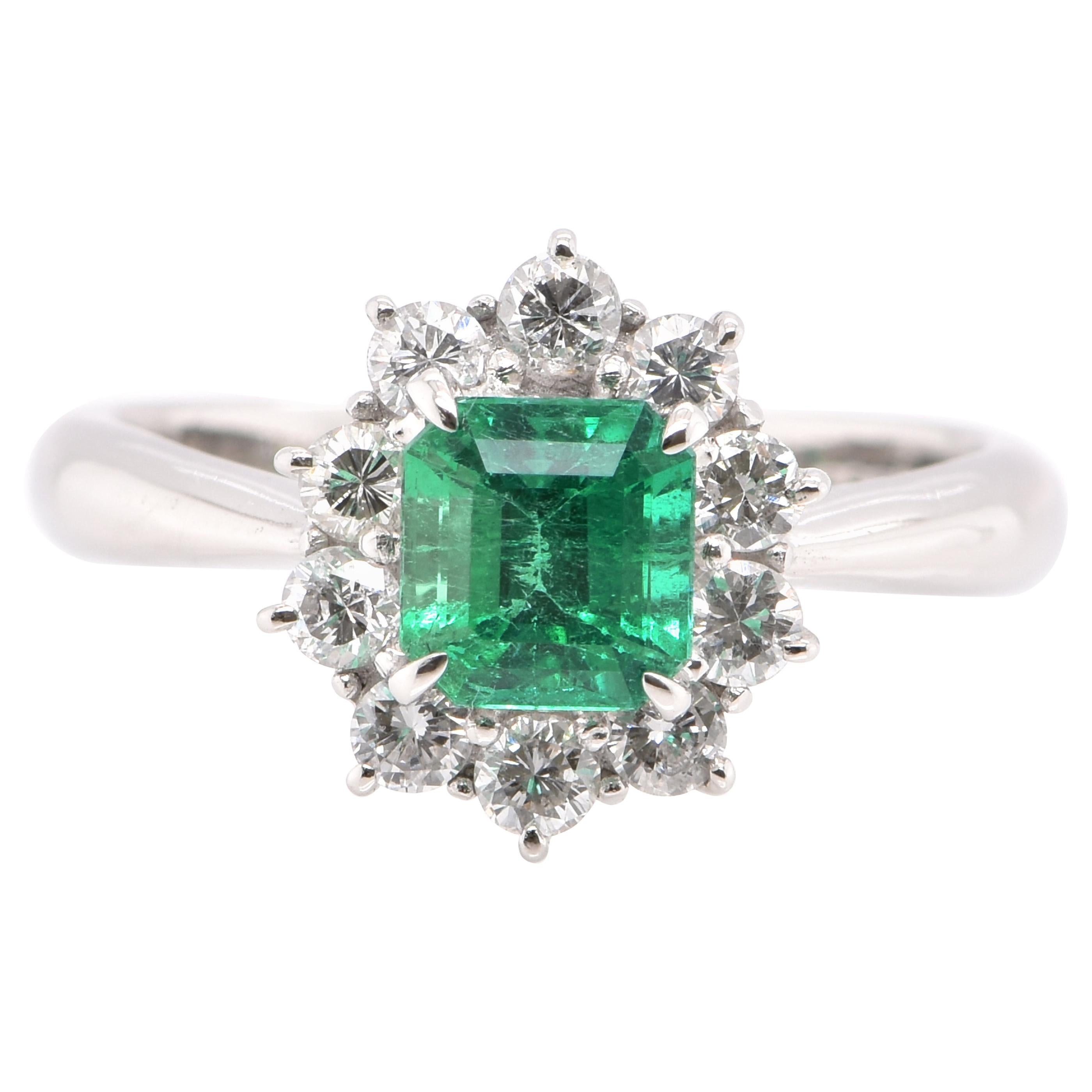 0.86 Carat Natural Emerald and Diamond Halo Ring Set in Platinum