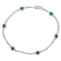 0.86 Carat Natural Emeralds and Diamonds Tennis Bracelet Set in Platinum