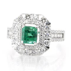 0.86 Carat Natural Vivid Green Emerald and Diamond Ring Set in Platinum