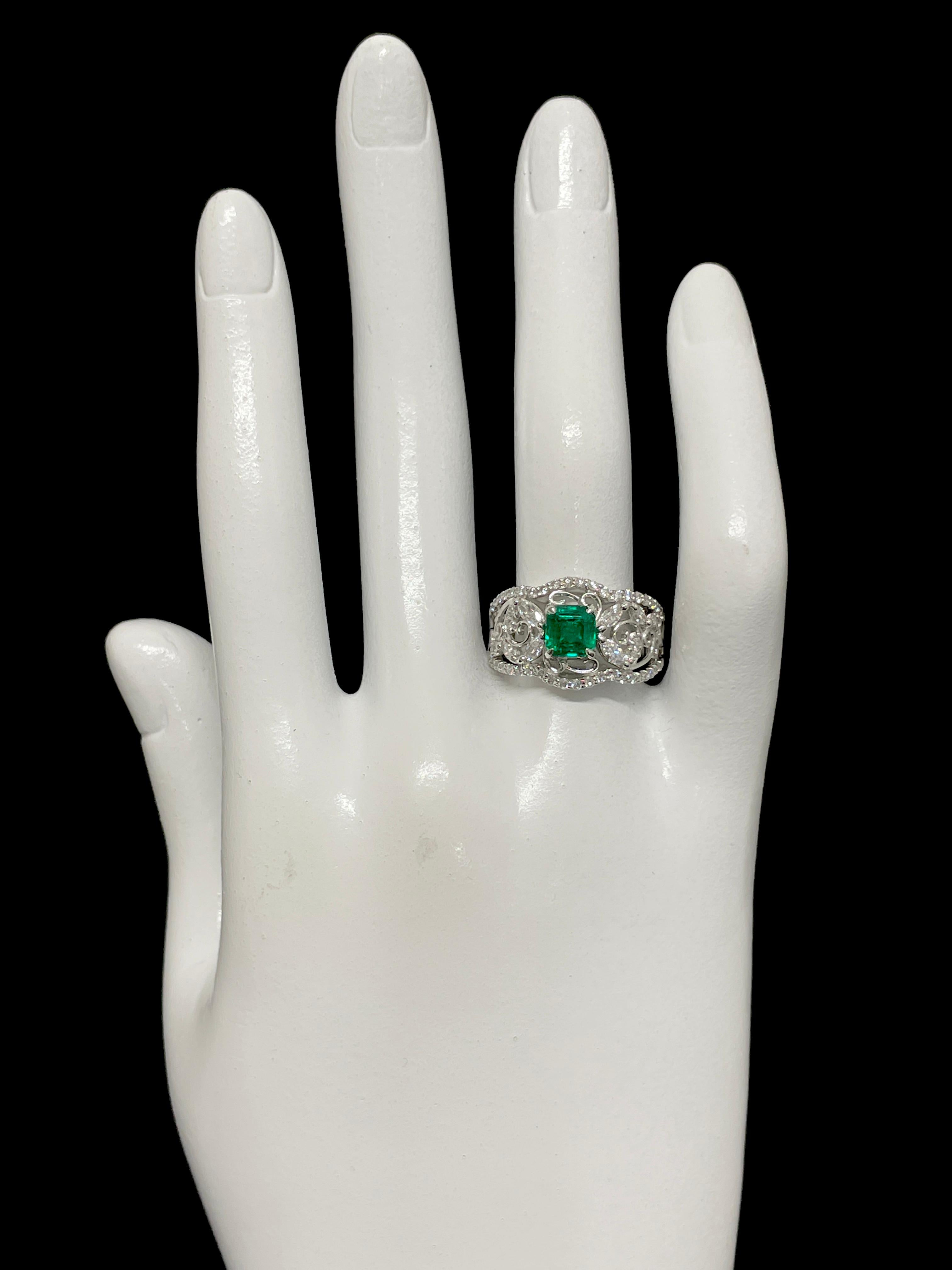 0.86 Carat Natural Vivid Green Emerald and Diamond Ring Set in Platinum 1
