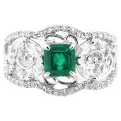 0.86 Carat Natural Vivid Green Emerald and Diamond Ring Set in Platinum