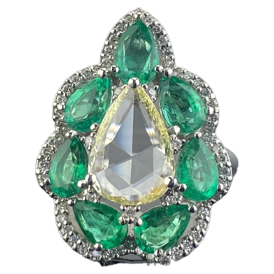 0.86 Carat Pear Shape Diamond and Emerald Engagement Ring For Sale