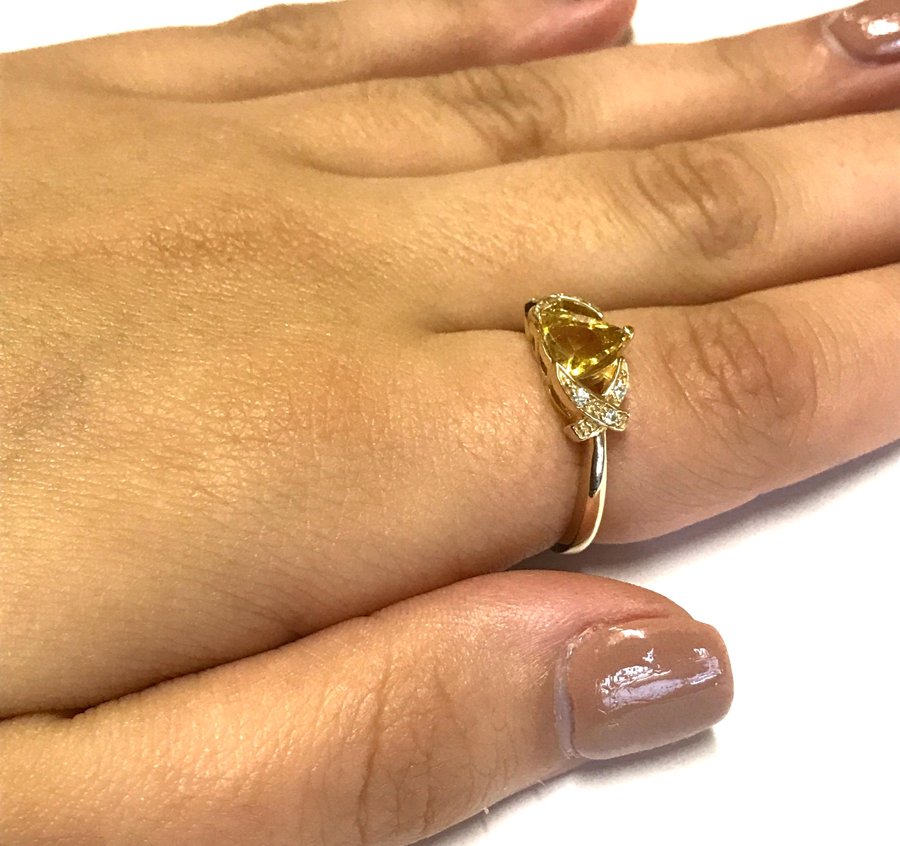 Material: 14k Yellow Gold 
Center Stone Details: 0.86 Carat Trillion Cut Yellow Beryl 
Mounting Diamond Details: 6 Round White Diamonds Approximately 0.05 Carats - Clarity: SI / Color: H-I
Ring Size: 6.25. Alberto offers complimentary sizing on all
