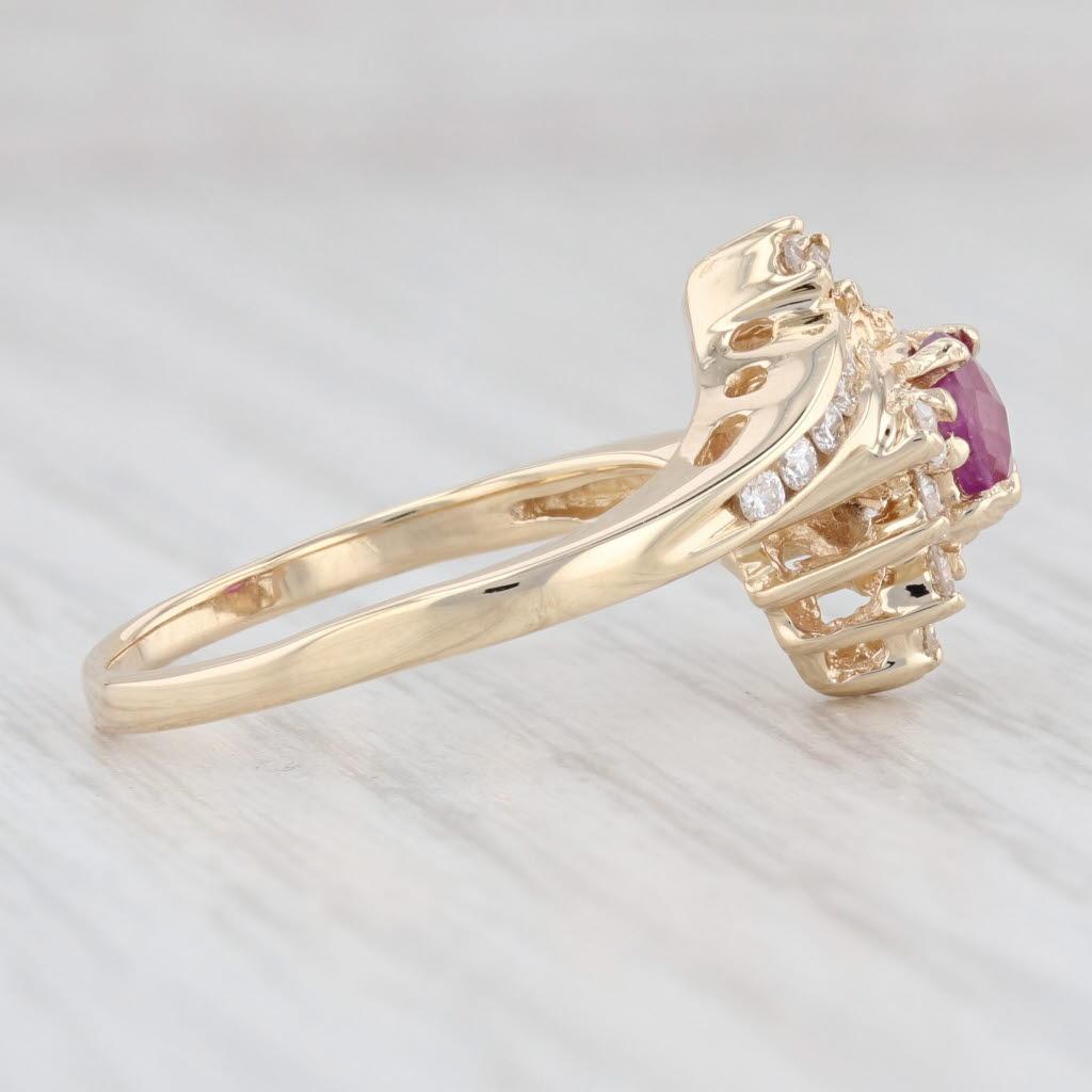 Gemstone Information:
- Natural Ruby -
Total Carats - 0.60ct
Cut - Oval Brilliant Checkerboard
Color - Red
Treatment - Routinely Enhanced

- Natural Diamonds -
Total Carats - 0.26ctw
Cut - Round Brilliant
Color - G - H
Clarity - VS2 

Metal: 14k