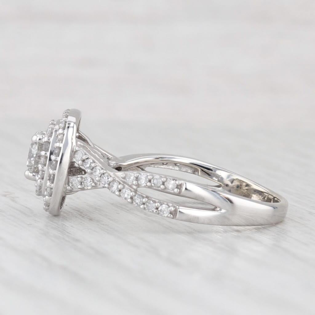 Gemstone Information:
- Natural Diamond - center
Carats - 0.46ct 
Cut - Round Brilliant
Color - H
Clarity - I1 

- Natural Diamonds - halos
Total Carats - 0.20ctw
Cut - Single
Color - G - H
Clarity - I2 - I3

-  Natural Diamonds - accents
Total