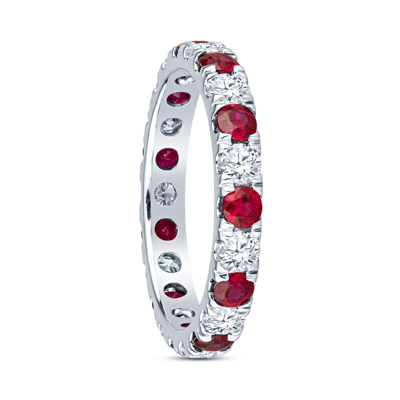 This beautiful eternity band features 0.86 carat total weight in round natural rubies alternating with 0.68 carat total weight in diamonds set in 18 karat white gold. It is a size 5.