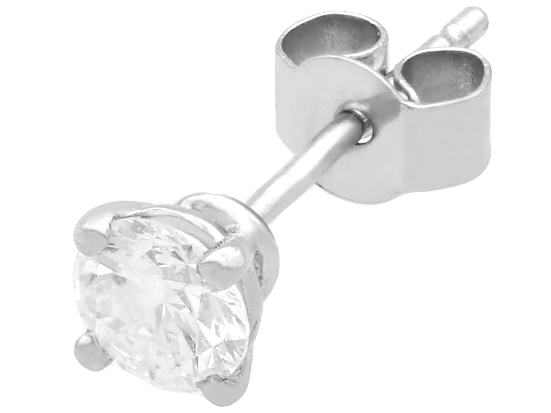 A fine and impressive pair of vintage and contemporary 0.87 carat diamond and platinum stud earrings; part of our diverse diamond jewelry and estate jewelry collections

These fine and impressive diamond stud earrings have been crafted in