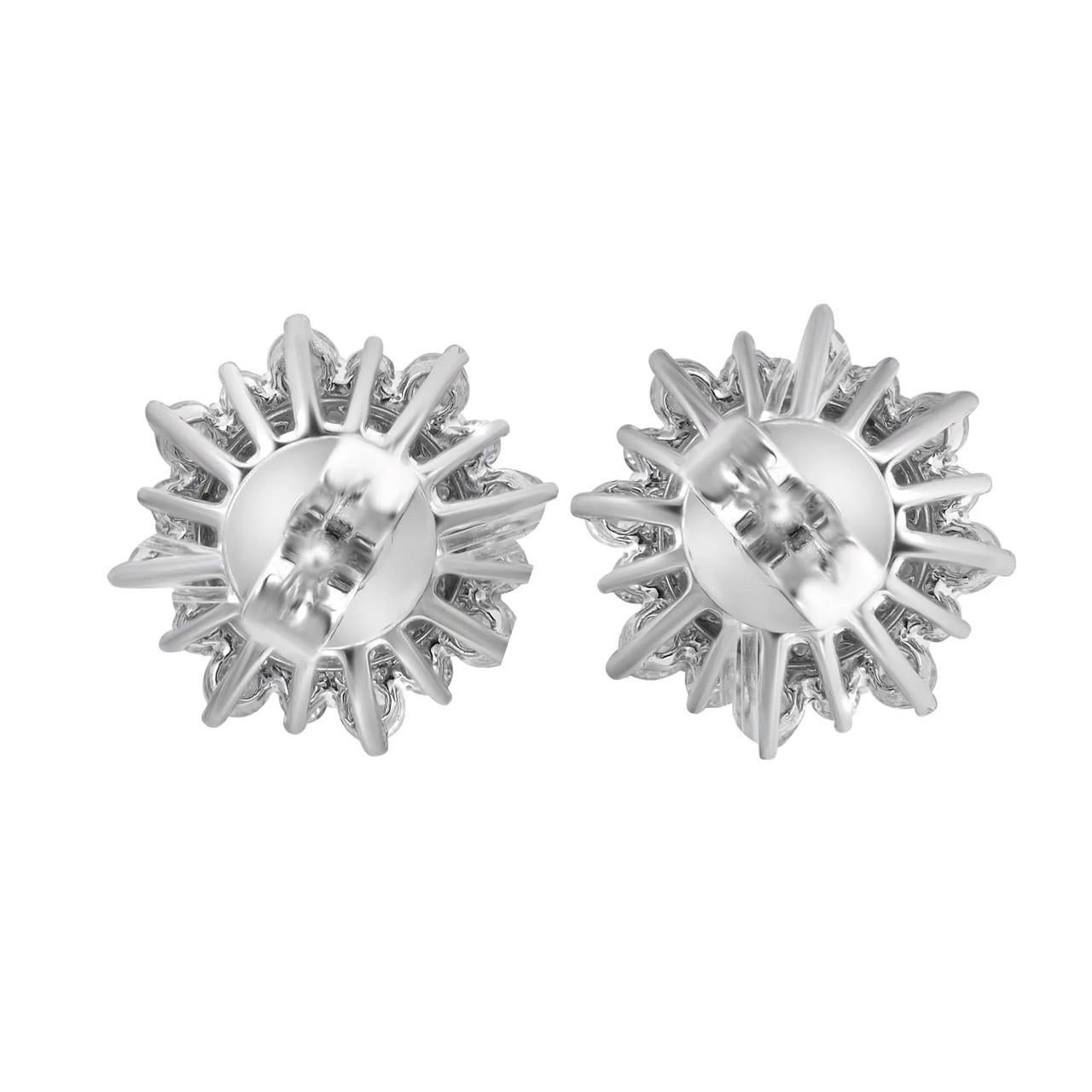 
Embrace elegance with these stunning diamond flower stud earrings, designed to effortlessly captivate attention. Delicately crafted in exquisite 18K white gold, they exude femininity and grace. Each earring showcases round cut diamonds meticulously