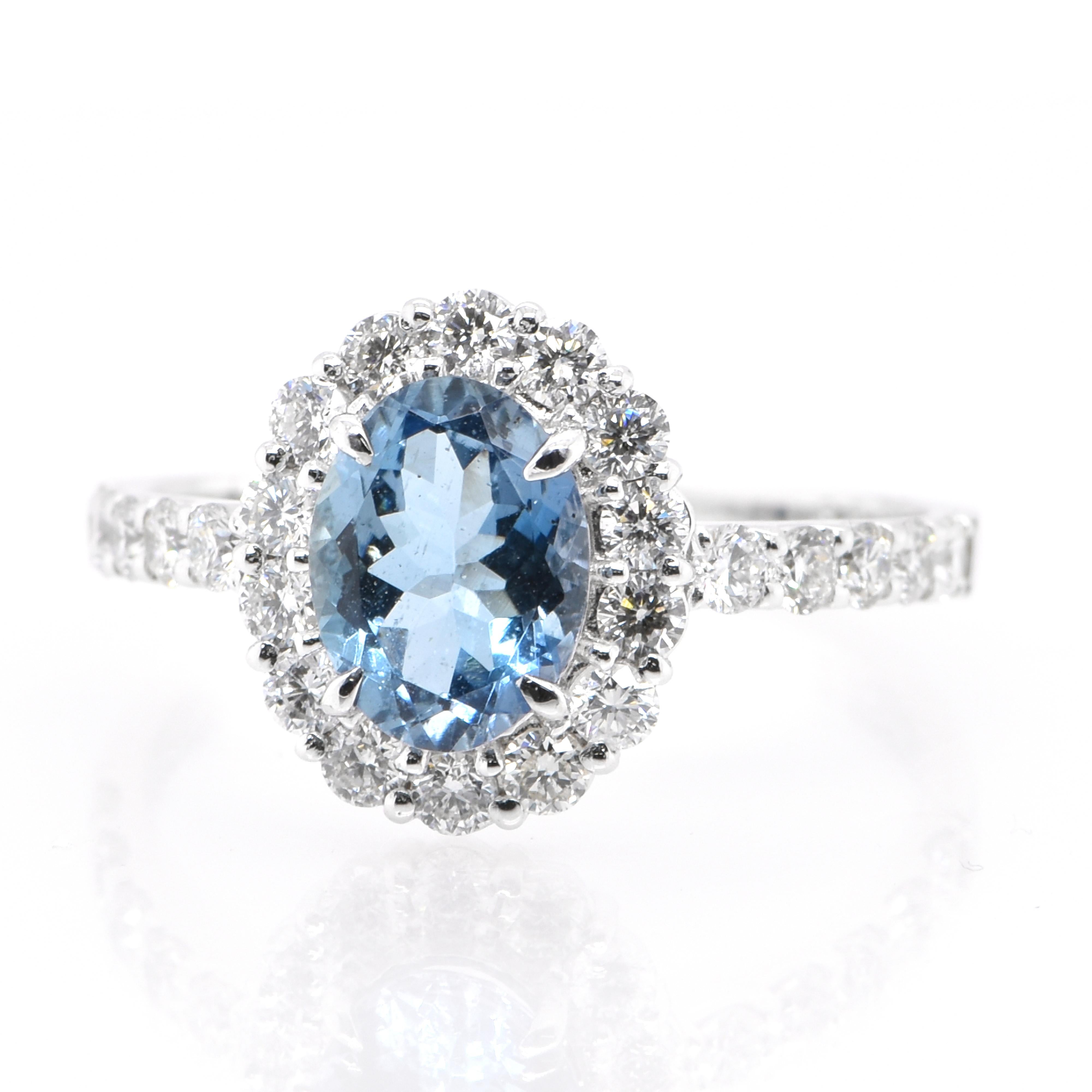 A beautiful Ring featuring a 0.87 Carat, Natural, Aquamarine and 0.65 Carats of Diamond Accents set in Platinum. Aquamarines have been prized gems throughout human history for their cool blue color. They historically come from the Minas Gerais,