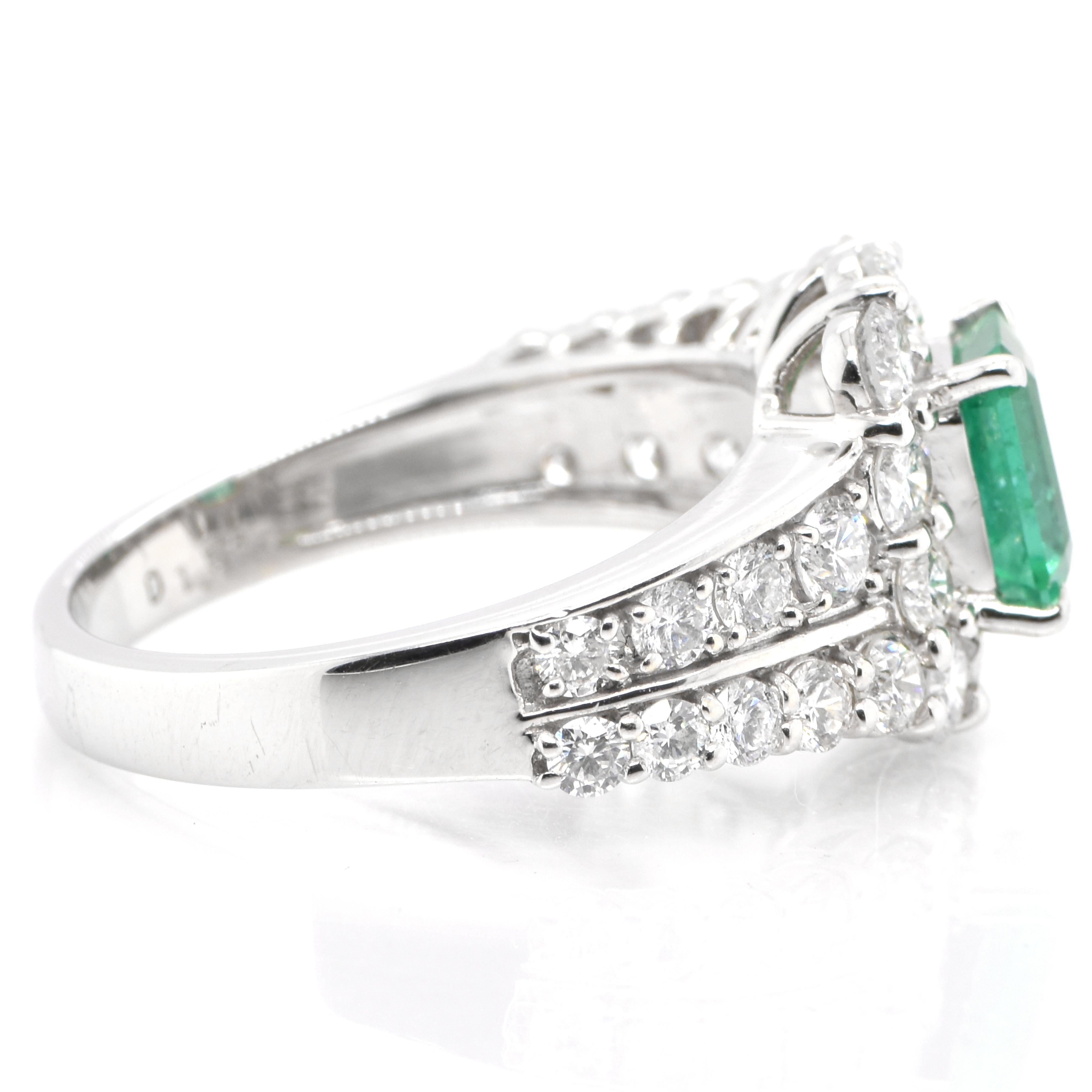 Emerald Cut 0.87 Carat Natural Emerald and Diamond Ring Set in Platinum For Sale