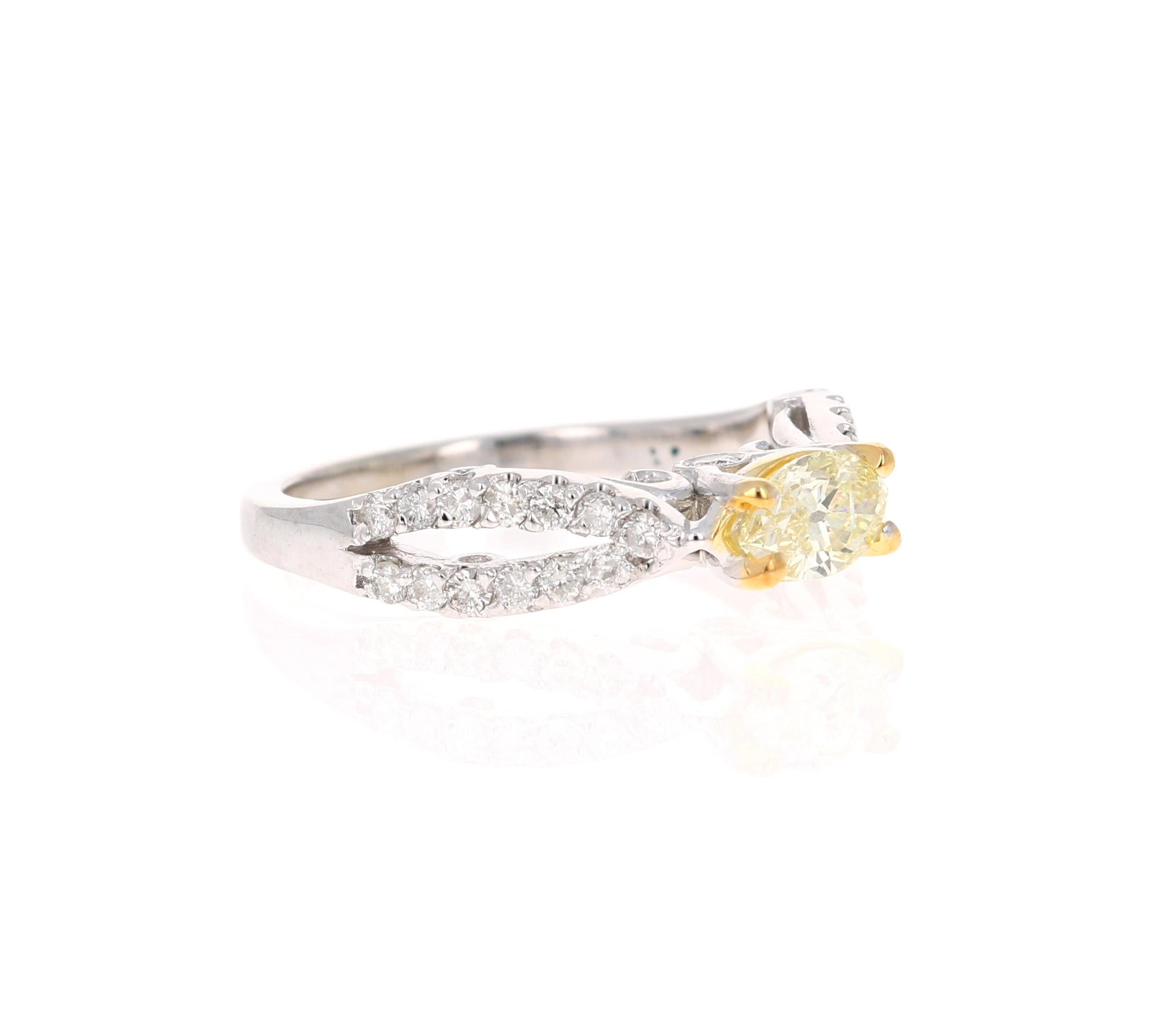 This beauty has a Natural Marquise Cut Yellow Diamond that weighs 0.47 Carats. It is surrounded with a 34 Round Cut Diamonds that weigh 0.40 Carats. The total carat weight of the ring is 0.87 Carats. 

The ring is curated in 14 Karat White Gold and