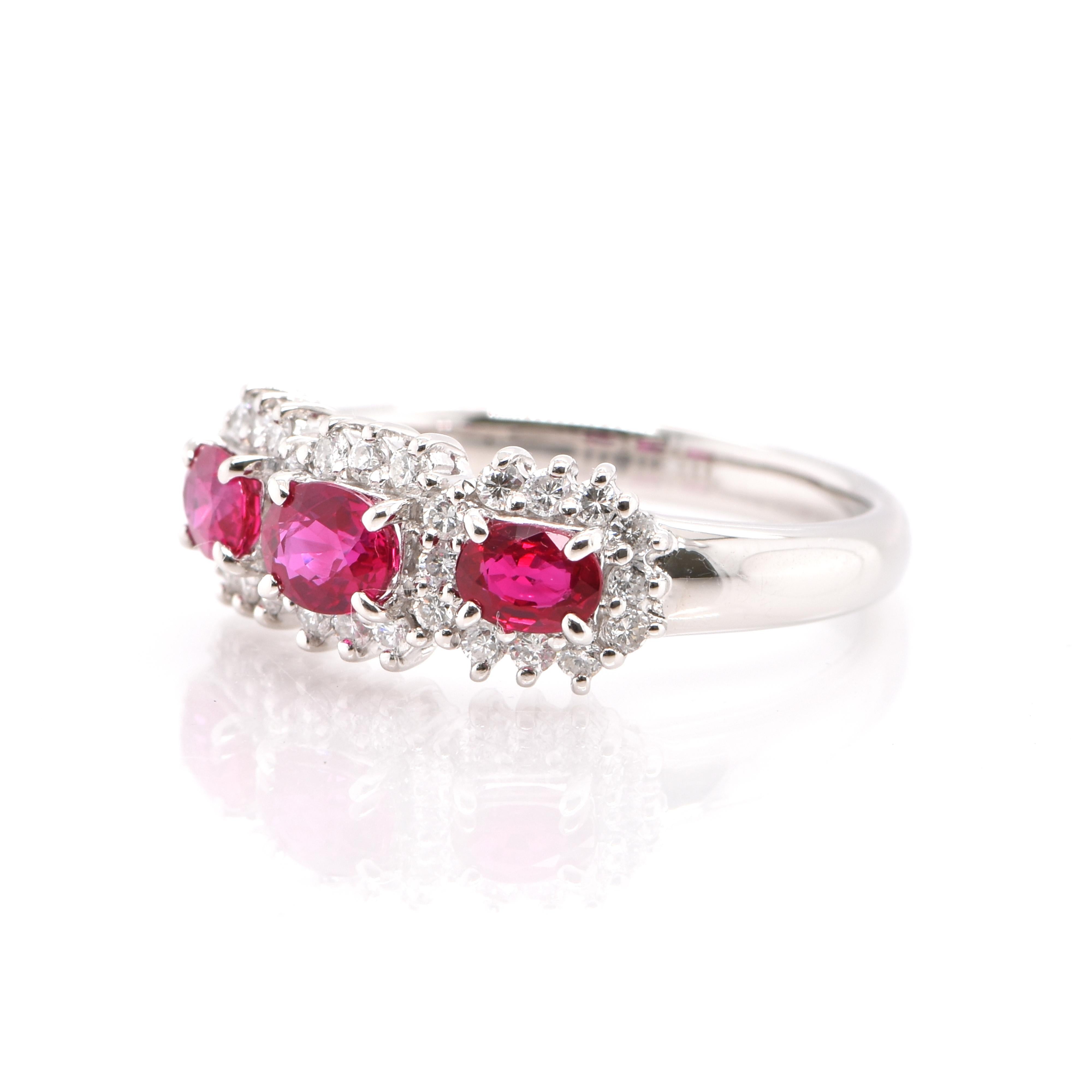 A beautiful Band Ring featuring a a total of 0.87 Carats of Natural, Ruby and 0.27 Carats of Diamond Accents set in Platinum. Rubies are referred to as 