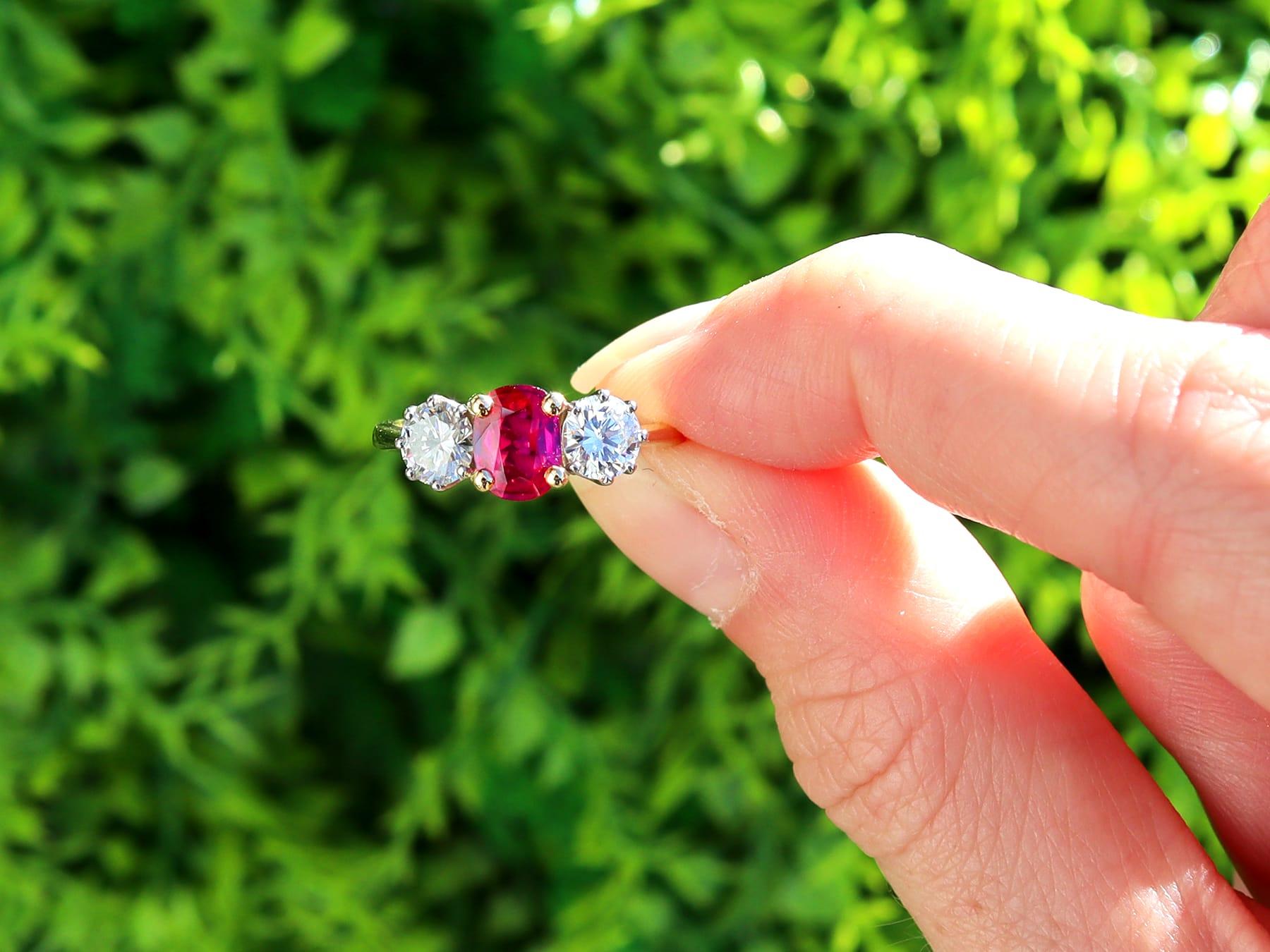 A stunning, fine and impressive contemporary 0.87 carat ruby and 0.94 carat diamond, 18 karat yellow gold, 18 karat white gold set trilogy ring; an addition to our collection of ruby trilogy rings.

This stunning, fine and impressive ruby trilogy