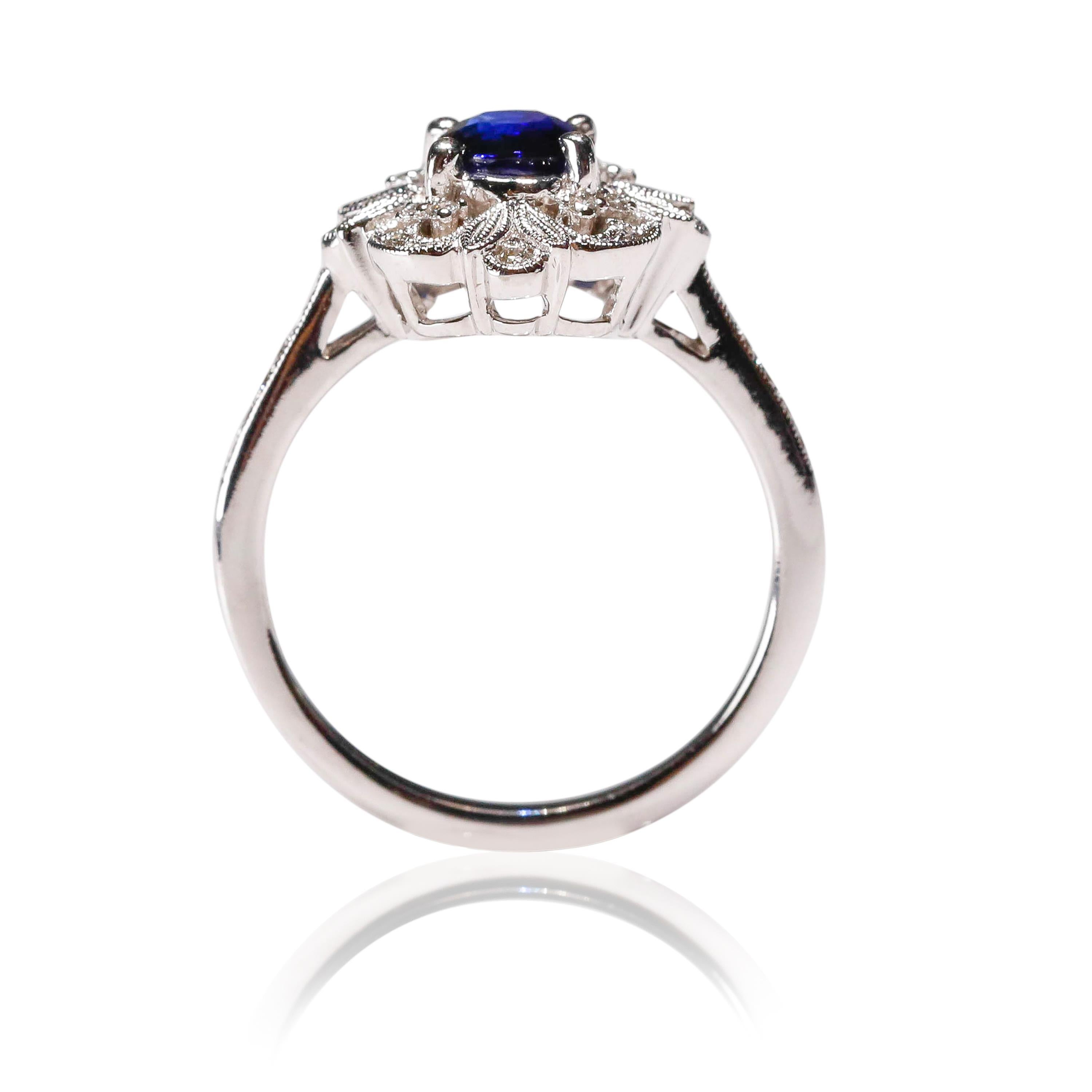 0.87 Carat blue Sapphire 0.13 Carat white Diamond 18 Karat Gold Floral Halo Ring

Crafted in 18 kt White Gold, this Unique design showcases a Blue Sapphire 0.87 TCW Oval shaped Sapphire, set in a halo of round-cut mesmerizing diamonds, Polished to a