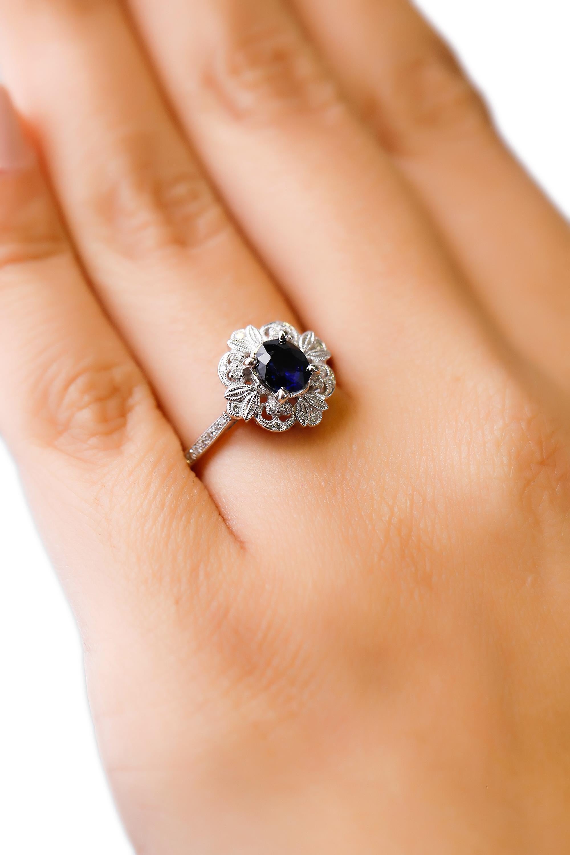 0.87 Carat blue Sapphire 0.13 Carat white Diamond 18 Karat Gold Floral Halo Ring 1